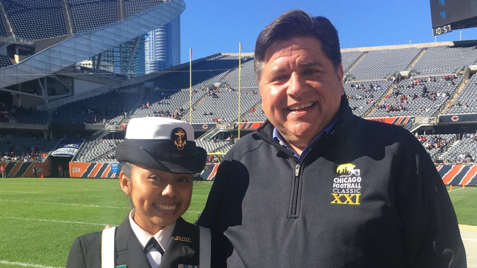 Chicago junior Luz Mayancela posed in 2019 with J.B. Pritzker, now Illinois governor, at Chicago's Soldier Field, where she took part in an ROTC color guard.