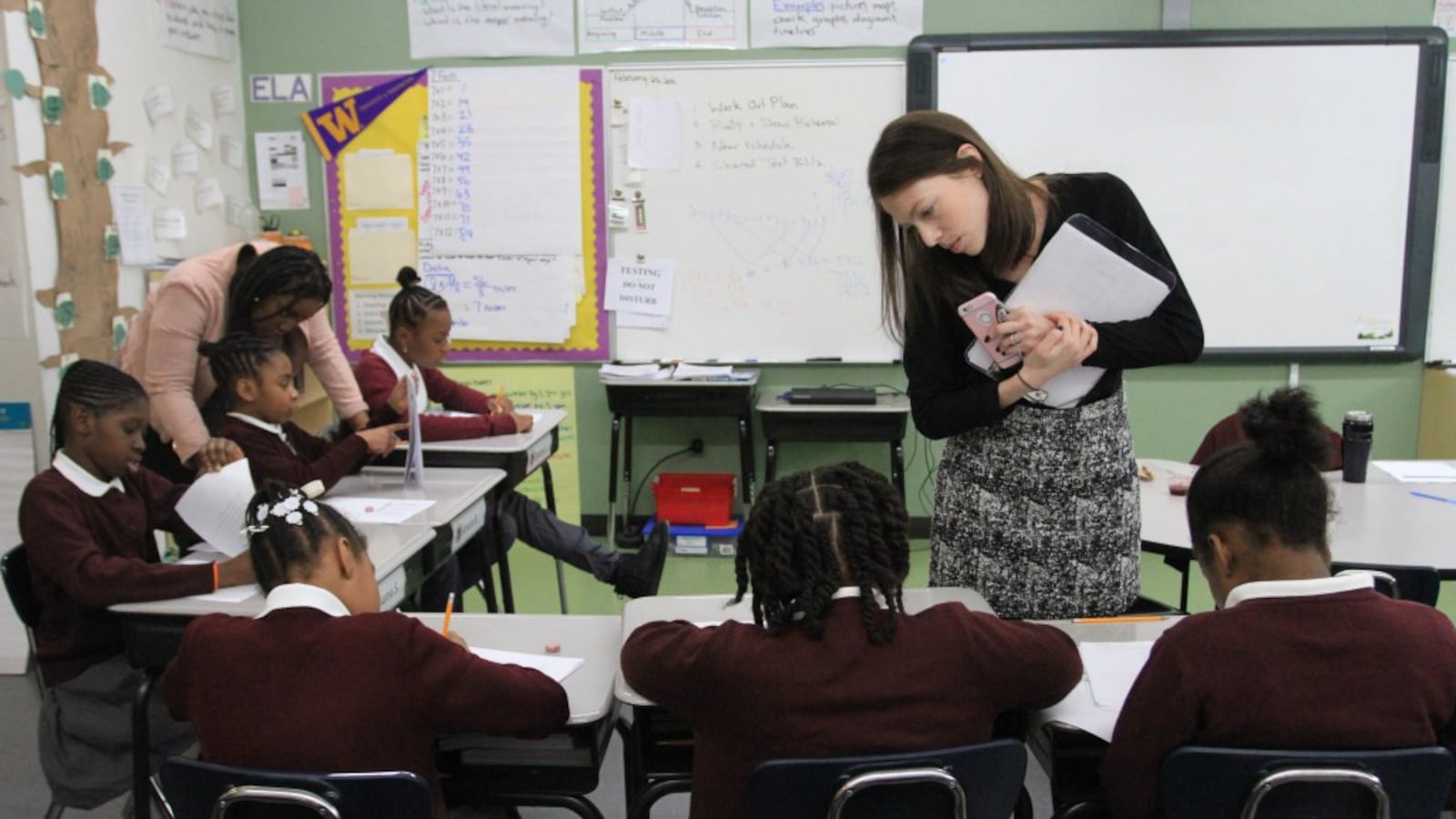Erica Murphy, school director of Brownsville Ascend Lower Charter School in New York, oversees students in a fourth-grade English class.