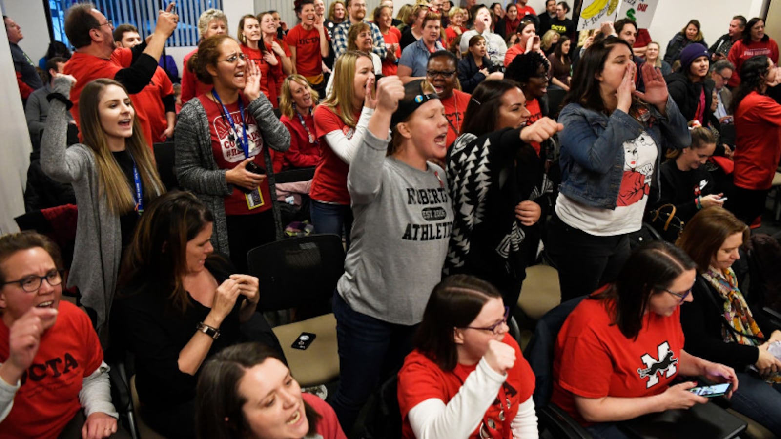 Denver teachers and their supporters get fired up before the Denver Classroom Teachers Association negotiations with Denver Public Schools district officials on Friday evening.