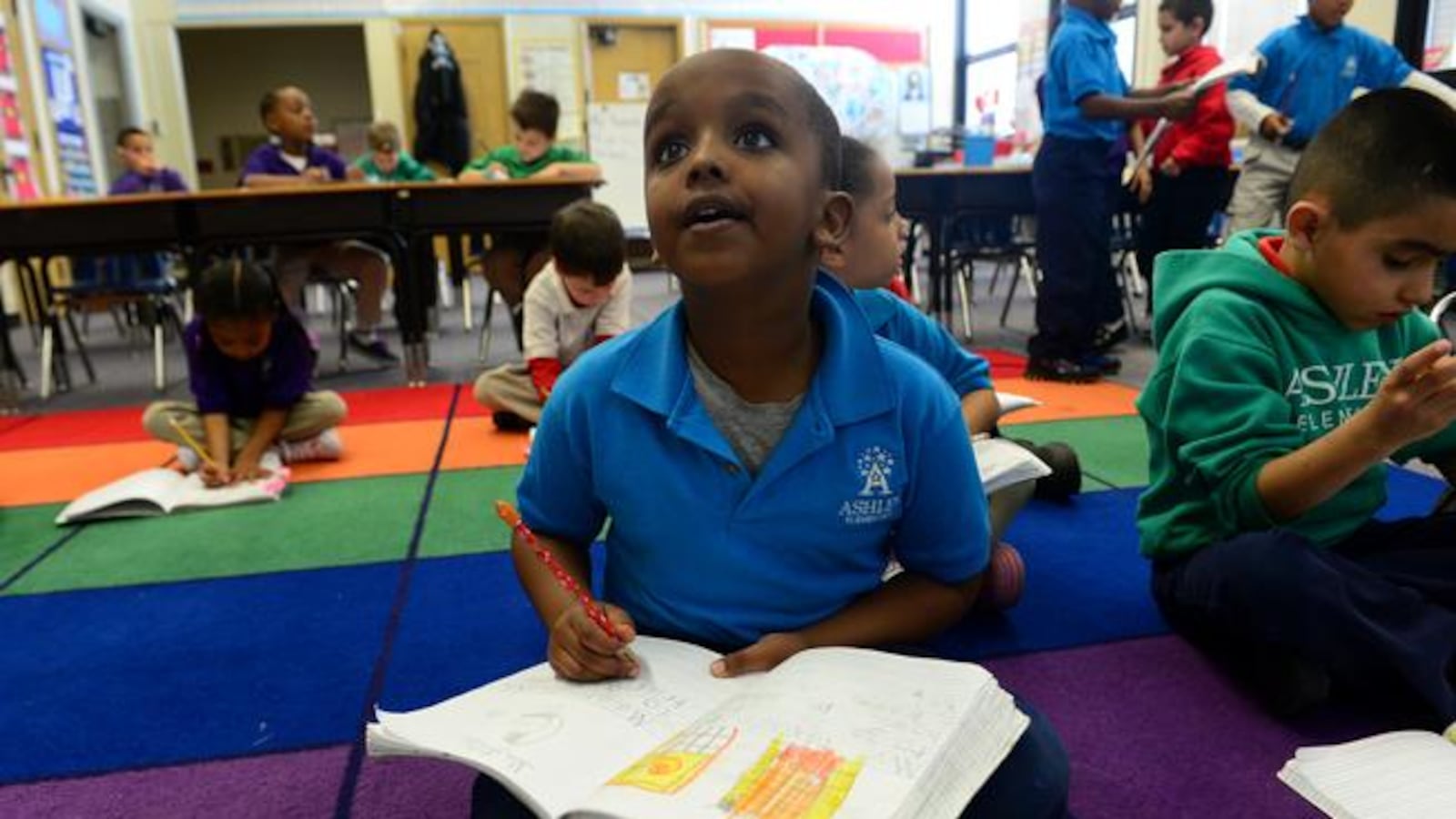 Five-year-old Samatar Abhullahi works during his kindergarten class at Denver's Ashley Elementary School.