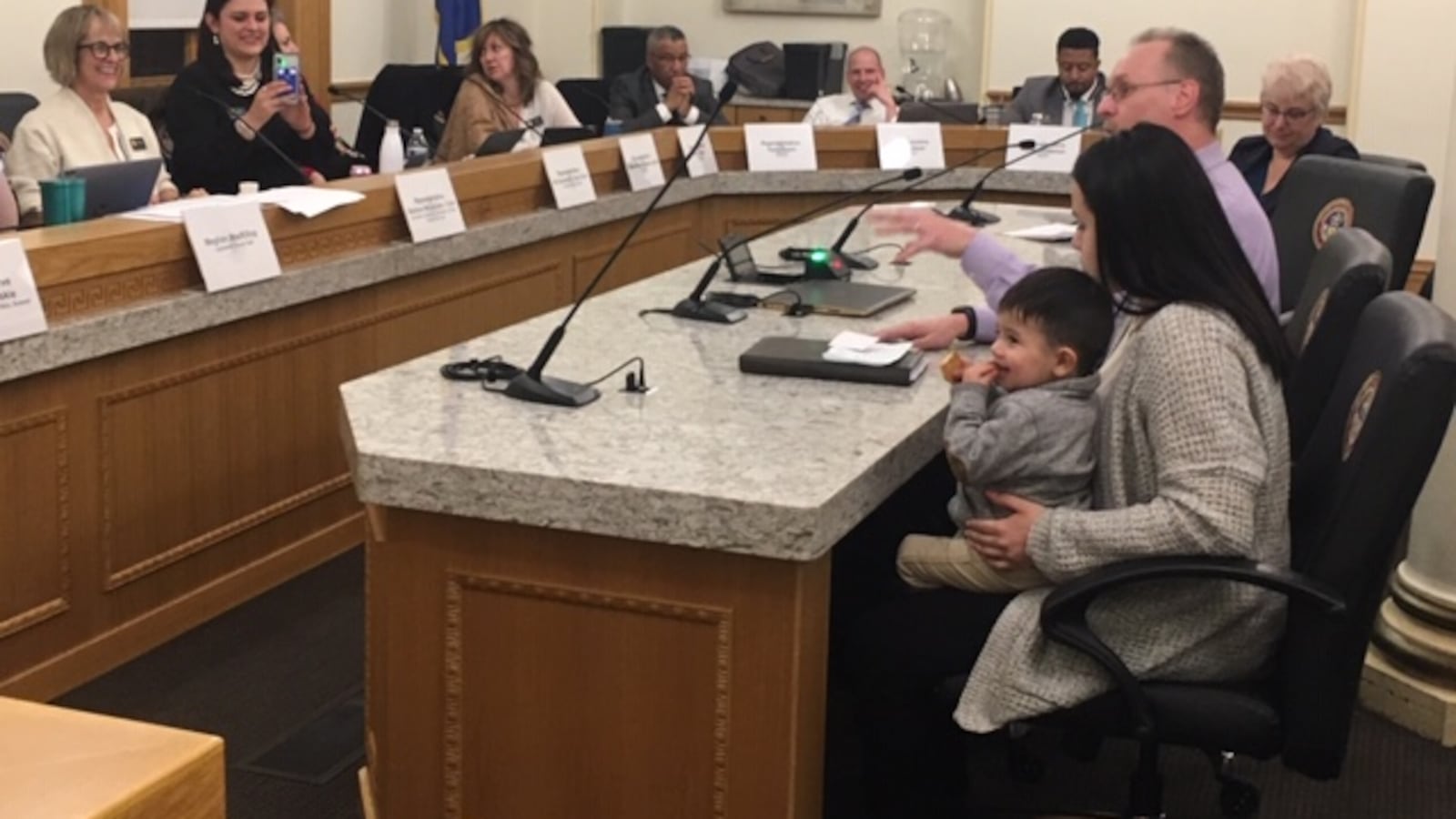 Sabrina Suarez brought her son to advocate for her charter school, which serves young parents and their children.