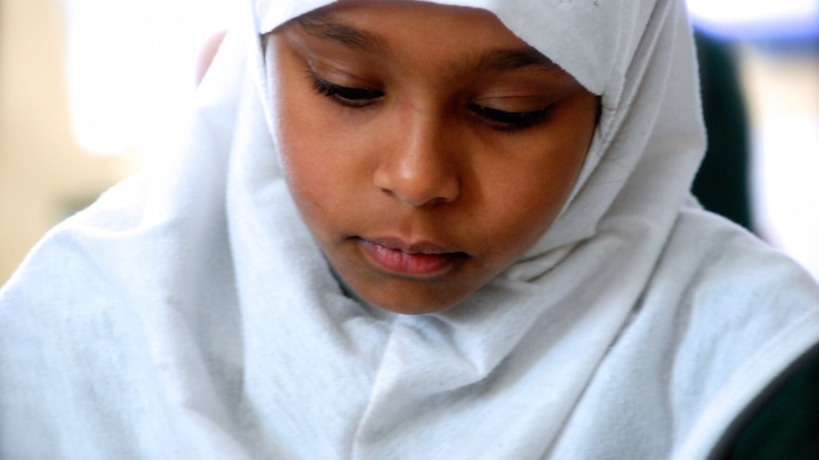 A third grader at AXL Academy worked on math problems in January.