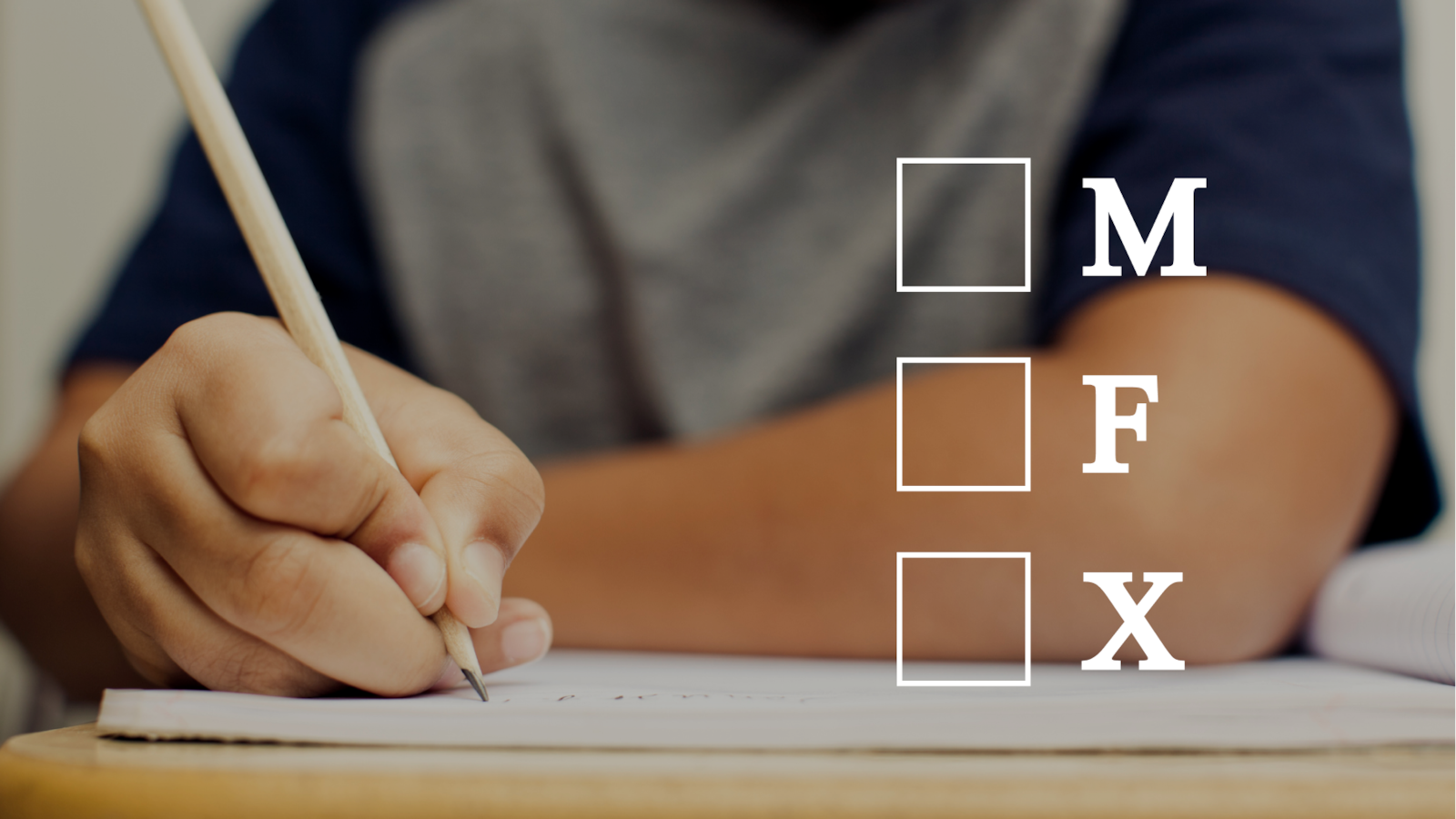 Student holds a pencil to a notebook placed on a desk. Overlaid on top of the image are three open check boxes with the letters M, F, and X.