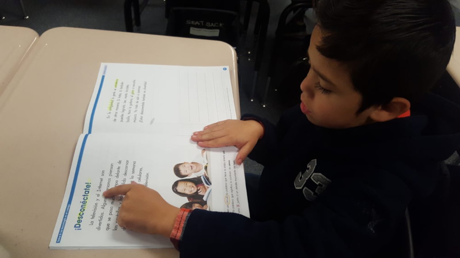 A first-grade student reads in Spanish in a biliteracy classroom at Dupont Elementary in Adams 14.