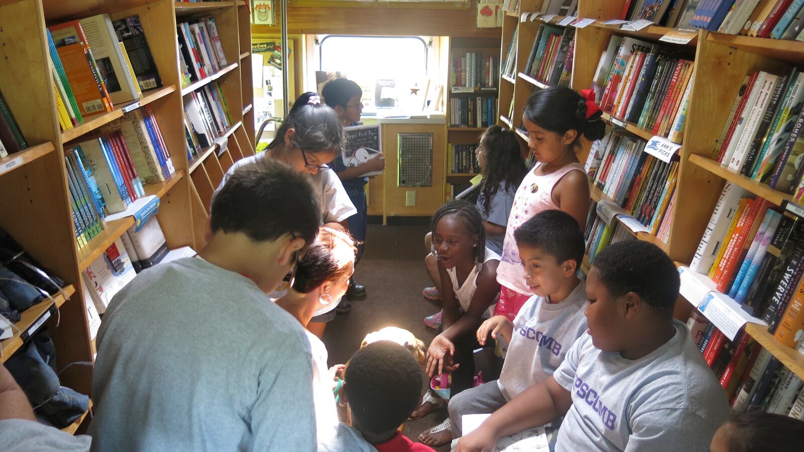 Students at Nashville's J.E. Moss Elementary School check out reading options on a bookmobile sponsored by Parnassus Books, a local bookstore. A new citywide initiative aims to bring in more community partners to support the district's literacy efforts.
