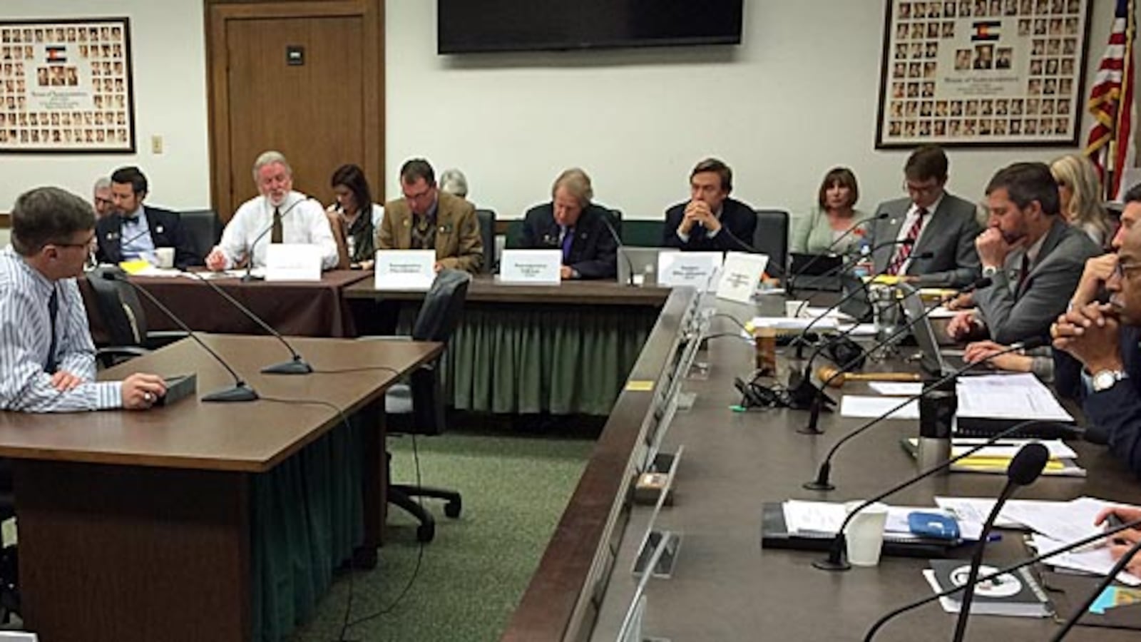 Testing task force chair Dan Snowberger (left) briefs legislators on the group's work.