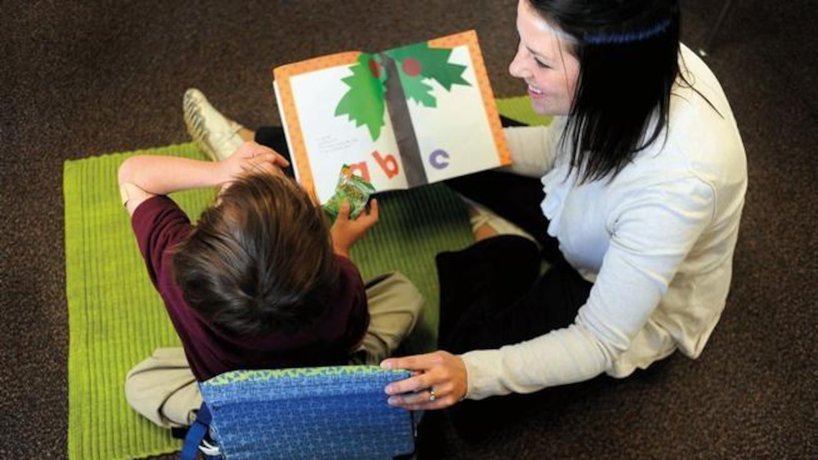 Kimberly Bertha, a special education teacher in Denver works with a student in 2010.