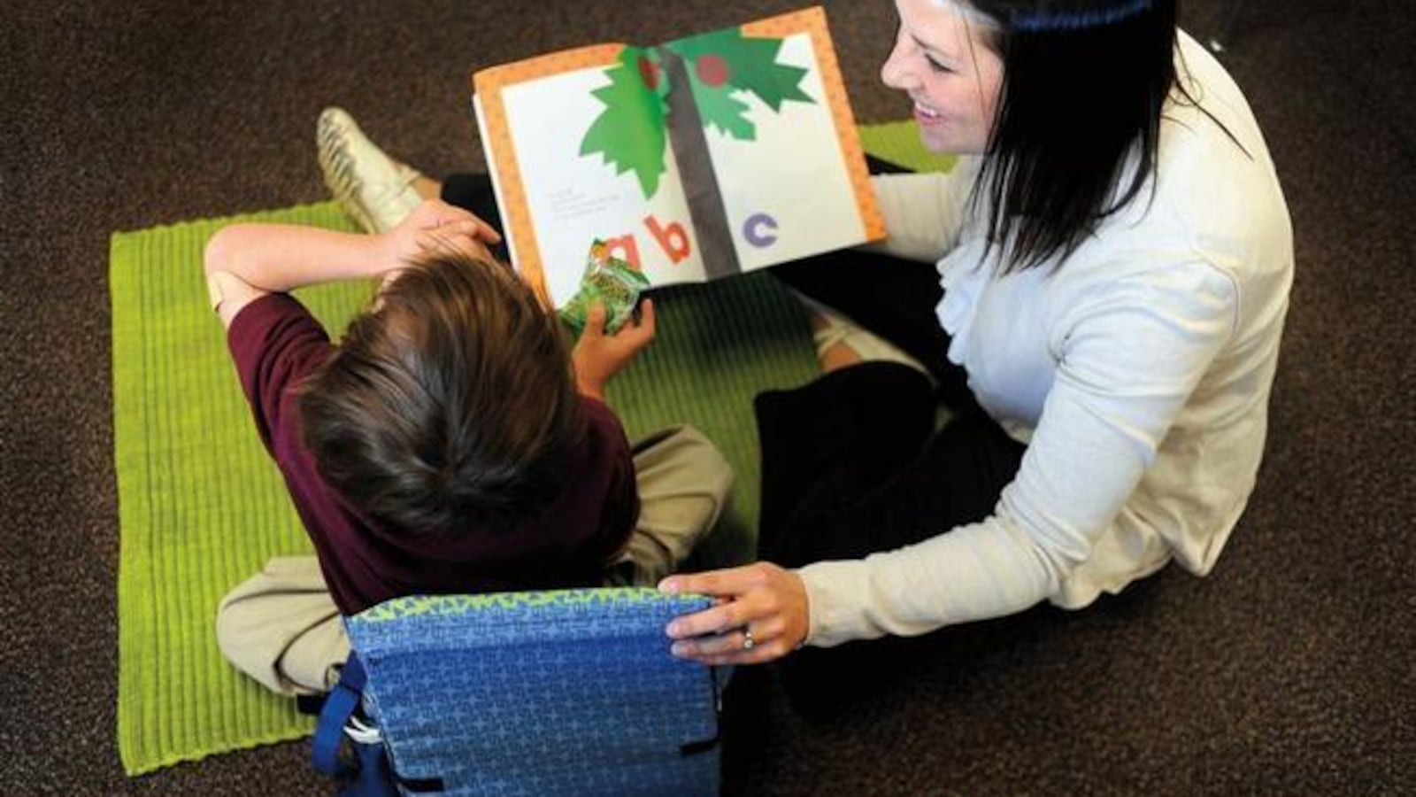 Kimberly Bertha, a special education teacher in Denver works with a student in 2010.