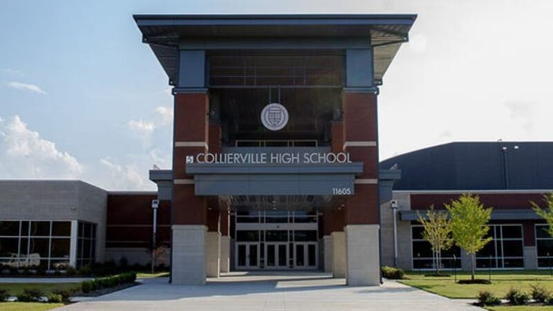 A brown brick school building with a sign reading “Collierville High School.”