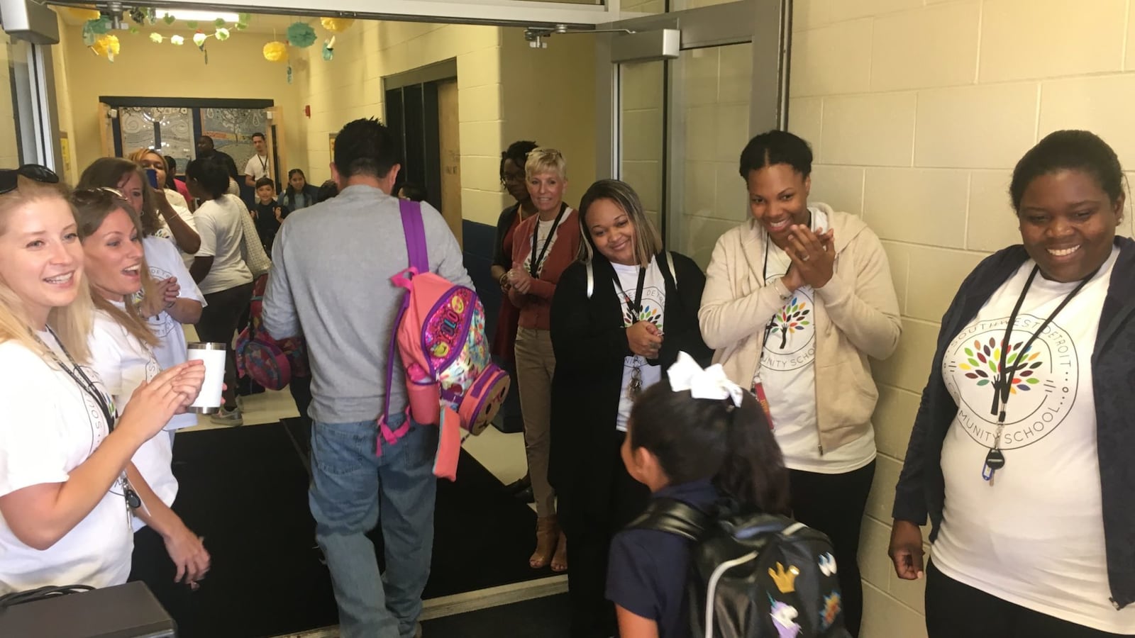 Teachers welcome students to the Southwest Detroit Community School on the first day of school. Seven of the charter's 31 educators last year entered the profession through a fast-track training program.
