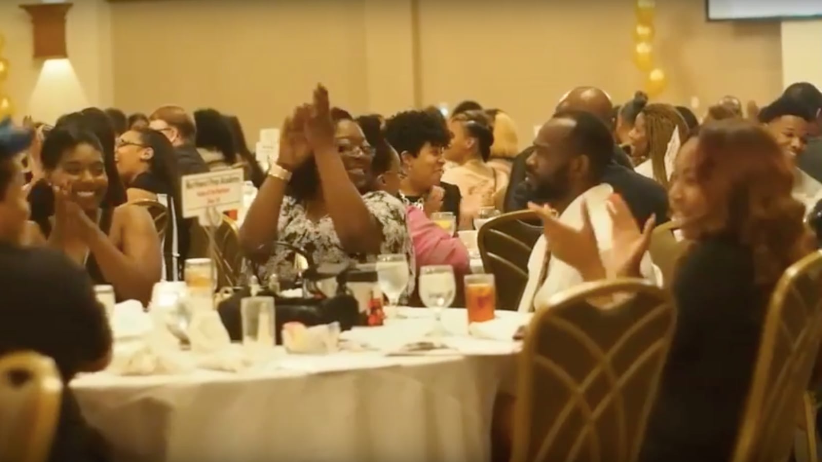 Educators and parents cheer as Shelby County Schools presents checks to each high school's top two students at the district's annual senior gala in April.