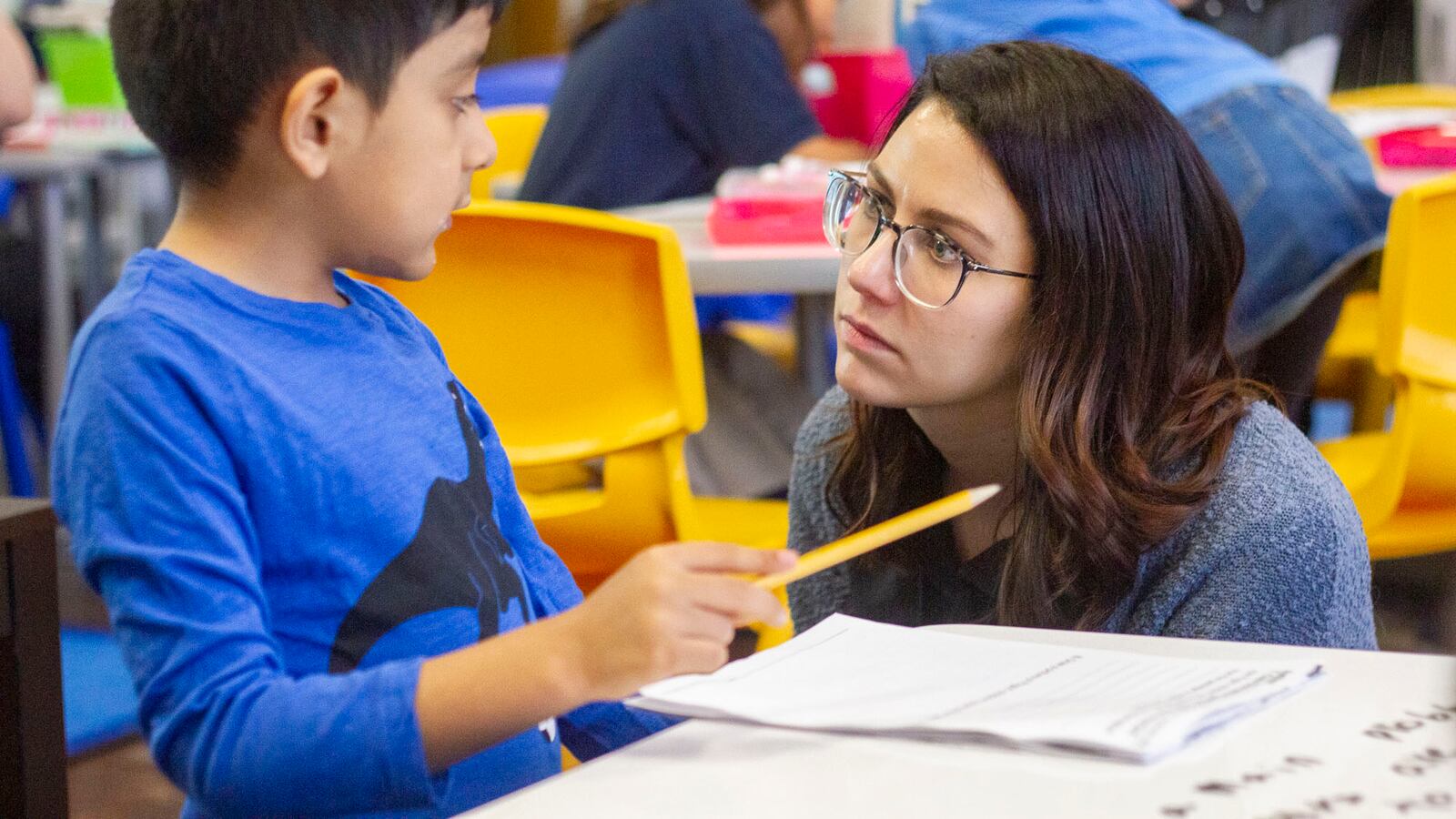 Teacher Sarah Schielke attends to a question from Nathan V. at CICS West Belden. The Chicago charter school employs the personalized learning method for its K-8 students. The school is part of the Chicago International Charter School network, and is managed by Distinctive Schools,. Photo by Stacey Rupolo/Chalkbeat NOTE: Last names not given by school