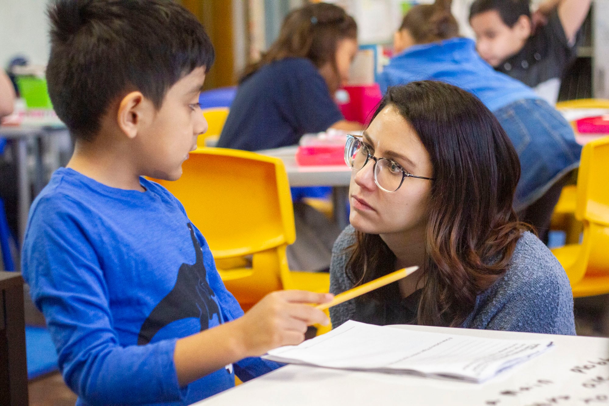 Teacher Sarah Schielke attends to a question from Nathan V. at CICS West Belden. The Chicago charter school employs the personalized learning method for its K-8 students. The school is part of the Chicago International Charter School network, and is managed by Distinctive Schools,. Photo by Stacey Rupolo/Chalkbeat NOTE: Last names not given by school