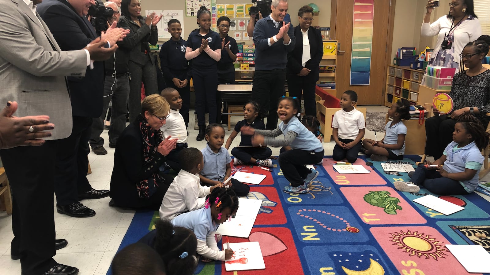 Illinois Gov. J.B. Pritzker, second from left, Chicago schools chief Janice Jackson and Mayor Rahm Emanuel, in front of TV camera, visit a pre-kindergarten classroom at John T. Pirie Fine Arts and Academic Center on March 22, 2019. Emanuel announced an expansion of preschool and day care.