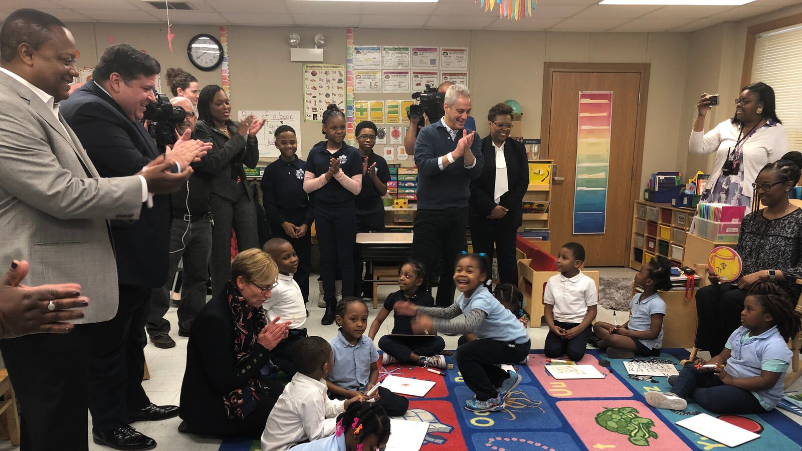 Illinois Gov. J.B. Pritzker, second from left, Chicago schools chief Janice Jackson and Mayor Rahm Emanuel, in front of TV camera, visit a pre-kindergarten classroom at John T. Pirie Fine Arts and Academic Center on March 22, 2019. Emanuel announced an expansion of preschool and day care.