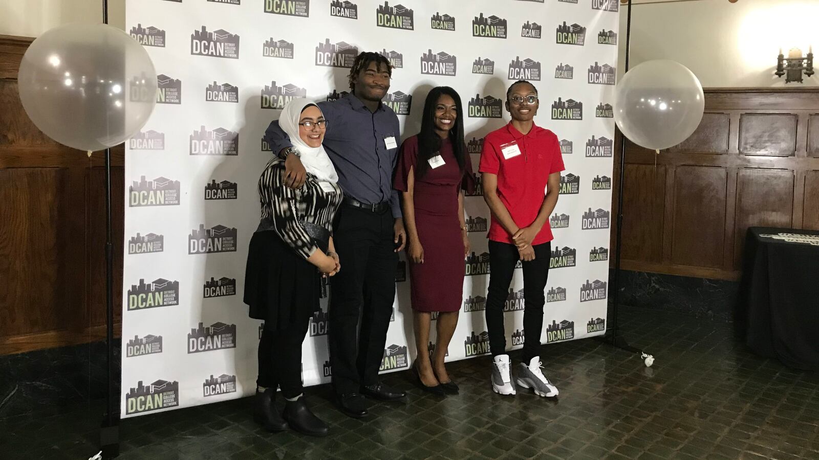 From left, America Yahya, De'Ernst Johnson, Myla Smith, and Anton Bronson pose for a photo after participating in a panel discussion about college success.