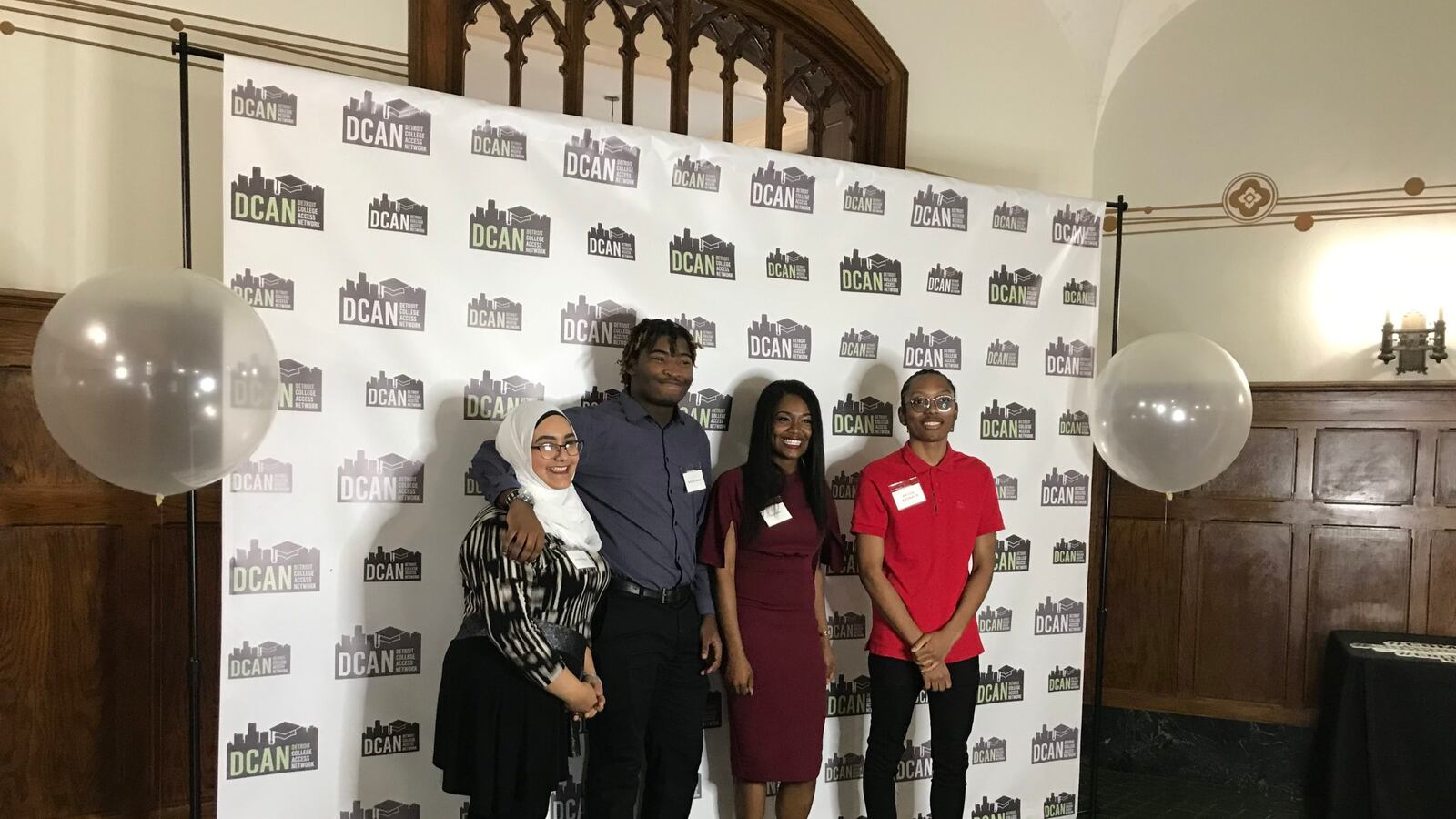 From left, America Yahya, De'Ernst Johnson, Myla Smith, and Anton Bronson pose for a photo after participating in a panel discussion about college success.