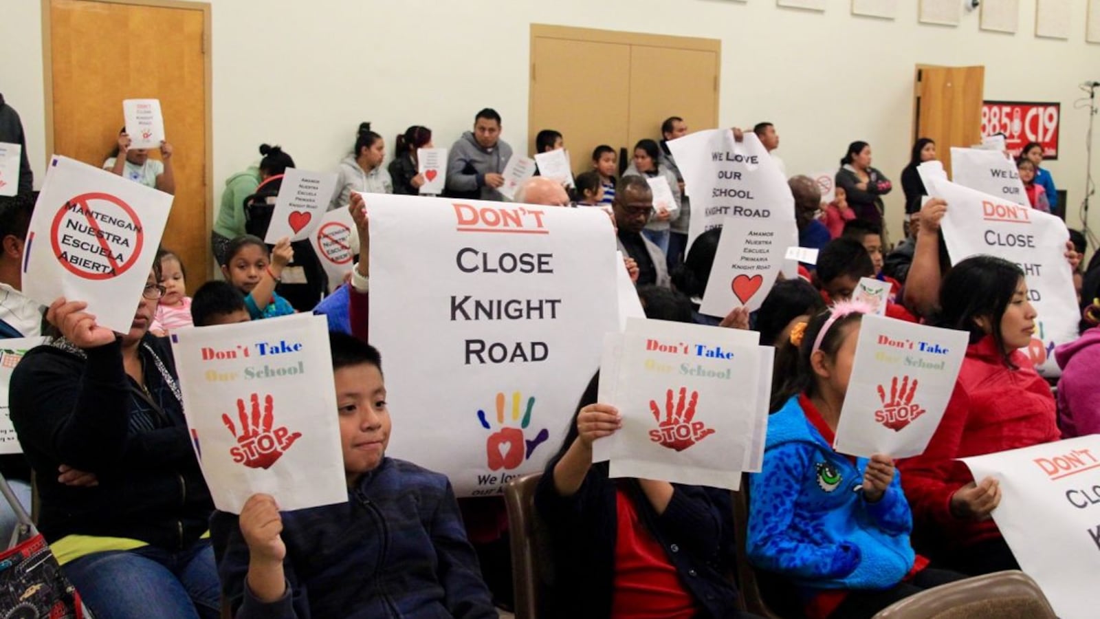 Parents and students from Knight Road Elementary School protest a proposal that would shutter their school during a board meeting for Shelby County Schools.
