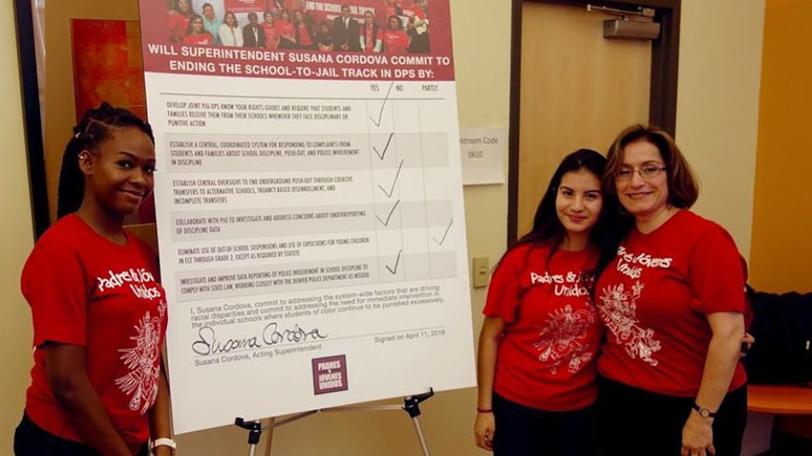 DPS acting superintendent Susana Cordova signed on to several proposed school discipline solutions Monday.  Here, she poses with students Jaquikeyah Fields and Patricia Cardenas.