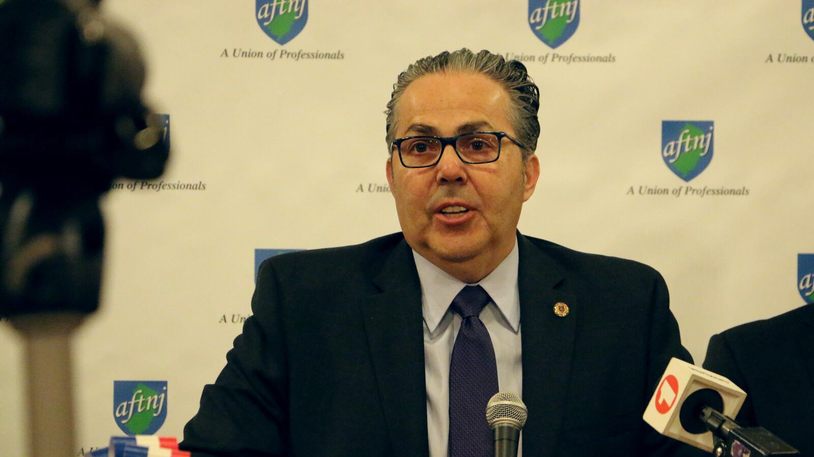 Newark Teachers Union President John Abeigon said the district has agreed to restore a "time-tested" system of rewarding teachers for advanced degrees and to eliminate a performance-based bonus.