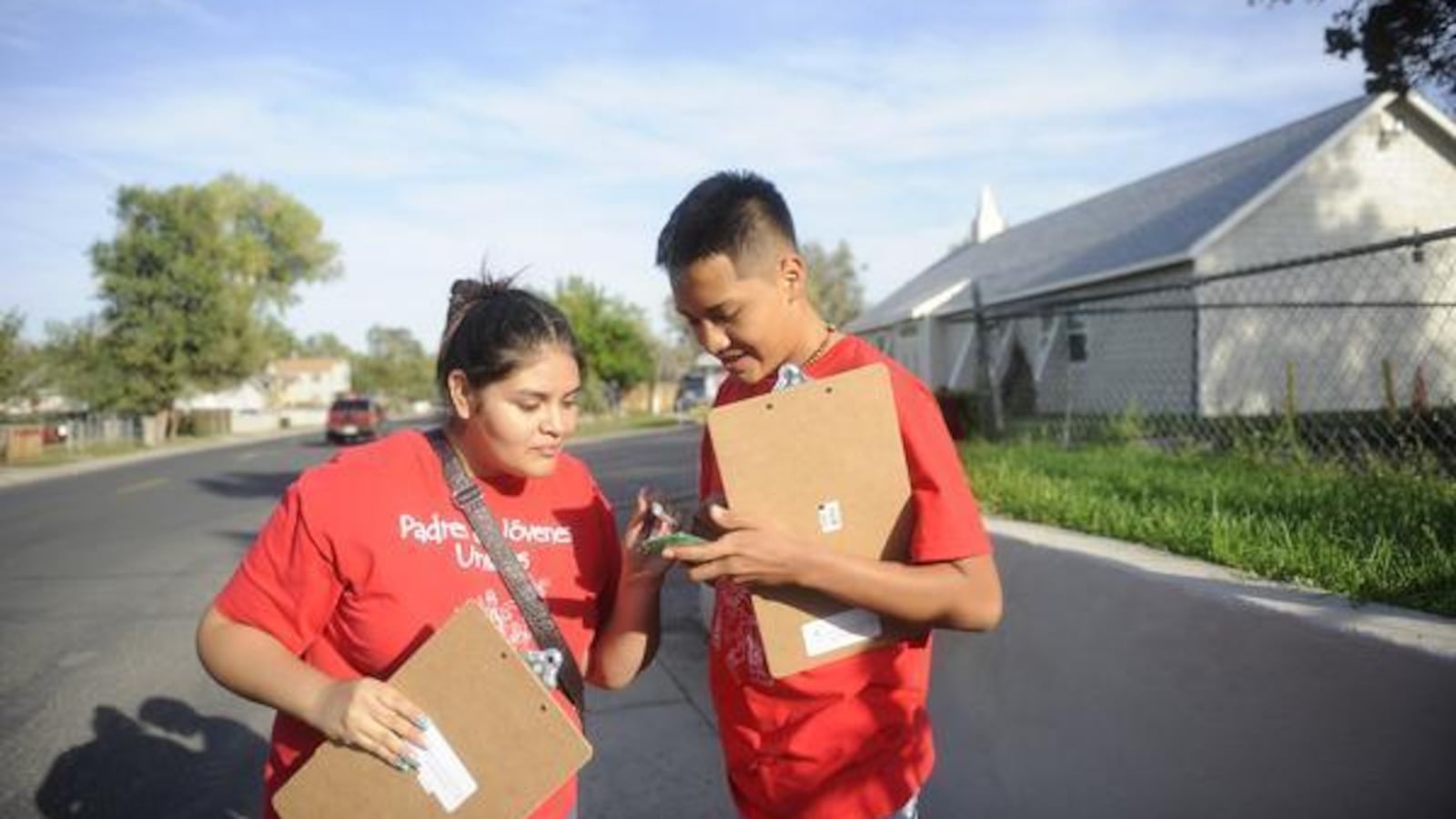 Valeria Cordova and Alex Duran with Padres & Jóvenes Unidos conduct a get-out-the-vote effort in 2013, encouraging voters to cast ballots but not advocating for a position.