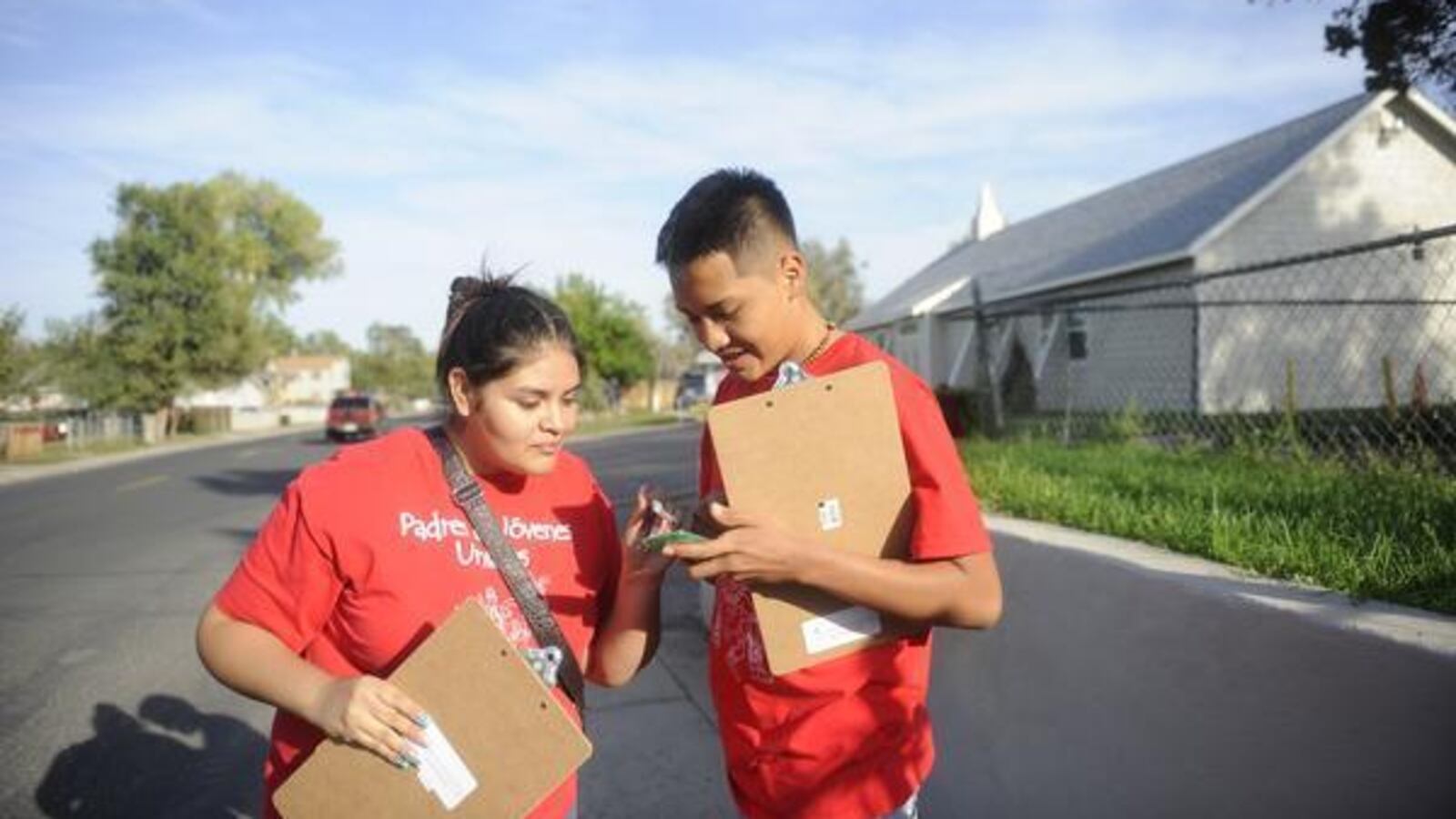 Valeria Cordova and Alex Duran with Padres & Jóvenes Unidos conduct a get-out-the-vote effort in 2013, encouraging voters to cast ballots but not advocating for a position.