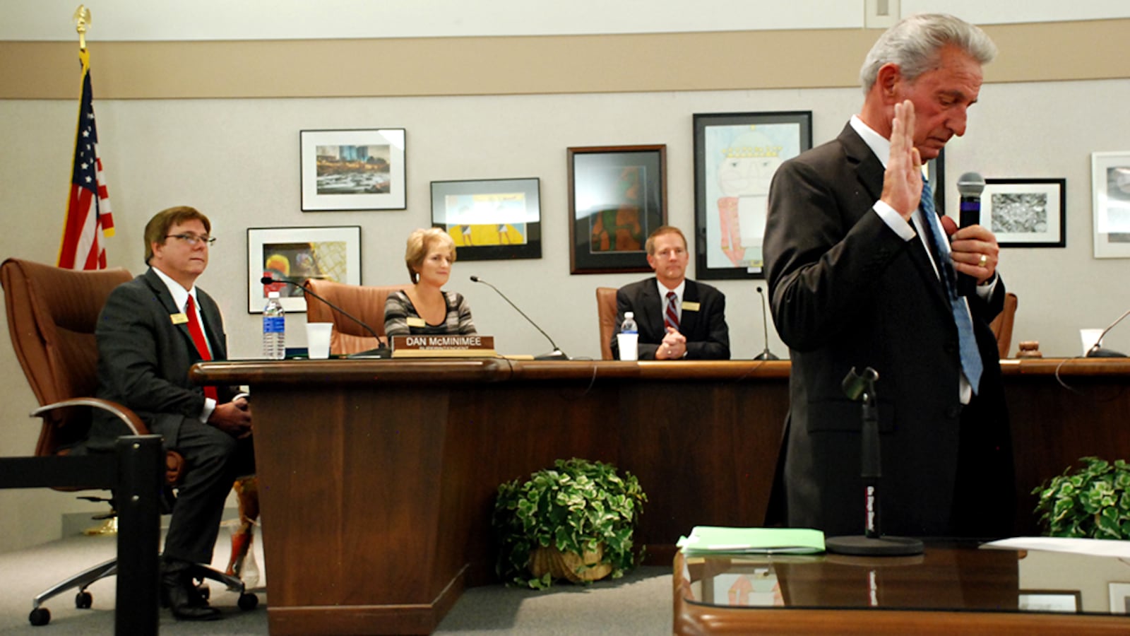 Ron Mitchell, right, takes the oath of office for the Jefferson County school board in 2015.