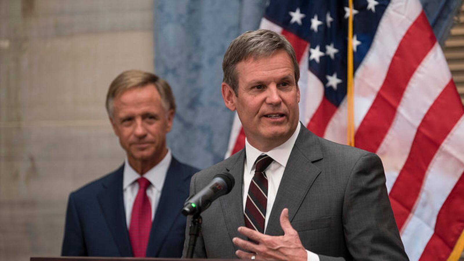 Bill Lee speaks with reporters in November 2018 after his election as Tennessee's 50th governor, as outgoing Gov. Bill Haslam looks on.