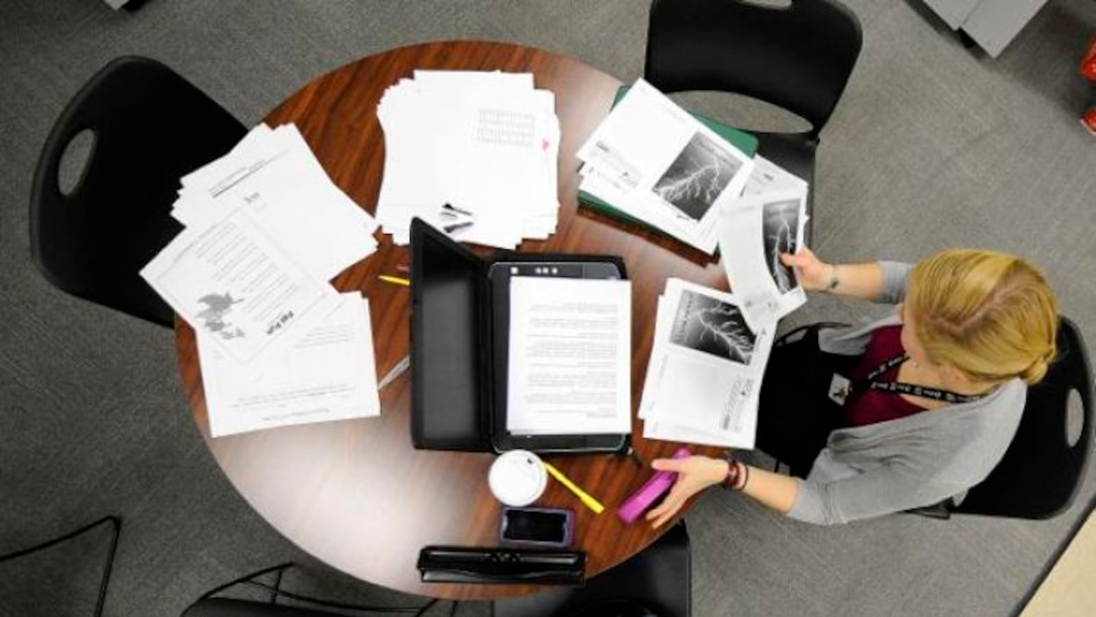 Third grade teacher Alyssa Roberts works on her lesson plan at Tindley Renaissance School. The bill's previous language would have let districts hire unlicensed teachers like charter schools can.
