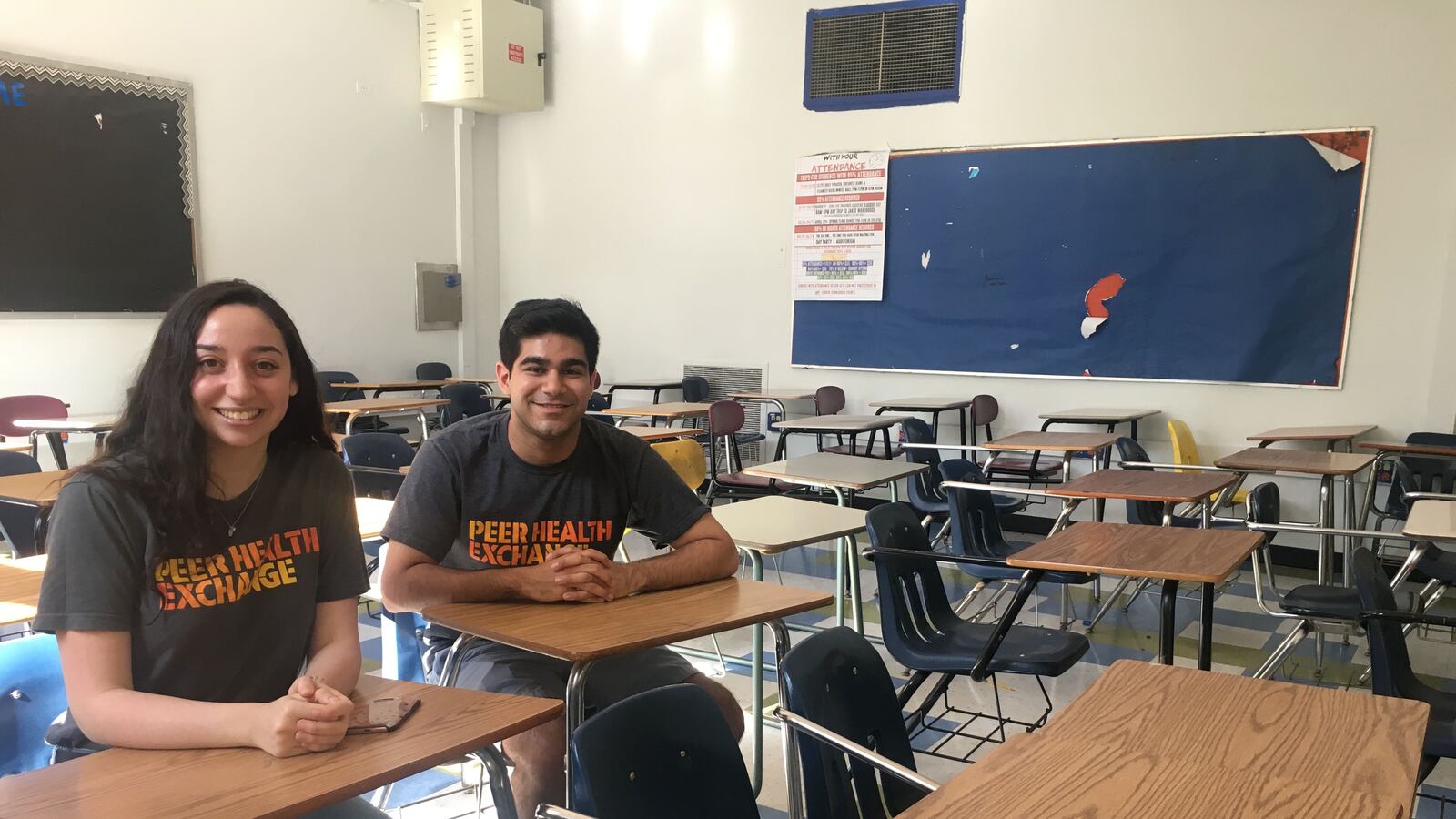 Julia Goldstein and Rahul Kukreja, two Peer Health Exchange educators, sit in the classroom at Hyde Park High School.