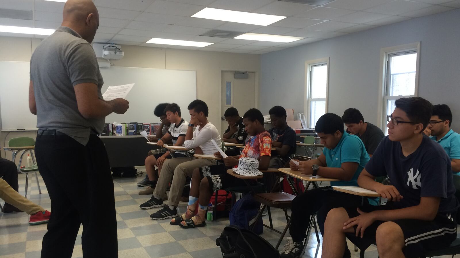 Students in Urban Ambassadors work together to prepare for a class debate on Common Core.