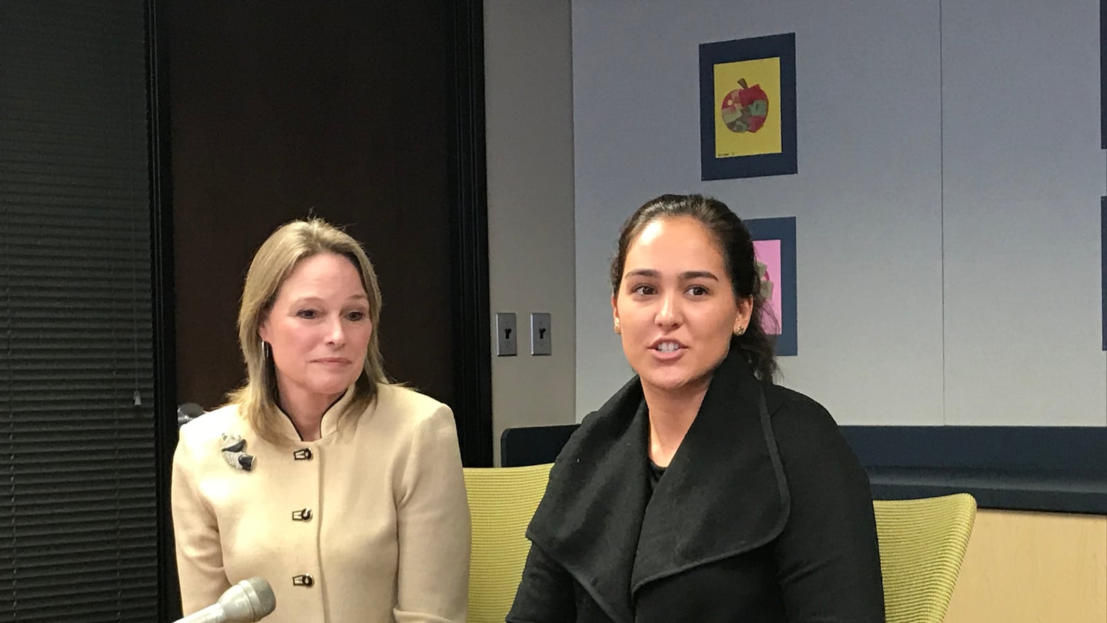 Karen Pastor, left, a veteran Detroit teacher, sits with Samantha Ciaffone during a news conference Wednesday. Pastor is mentoring Ciaffone through a new program in the Detroit Public Schools Community District.