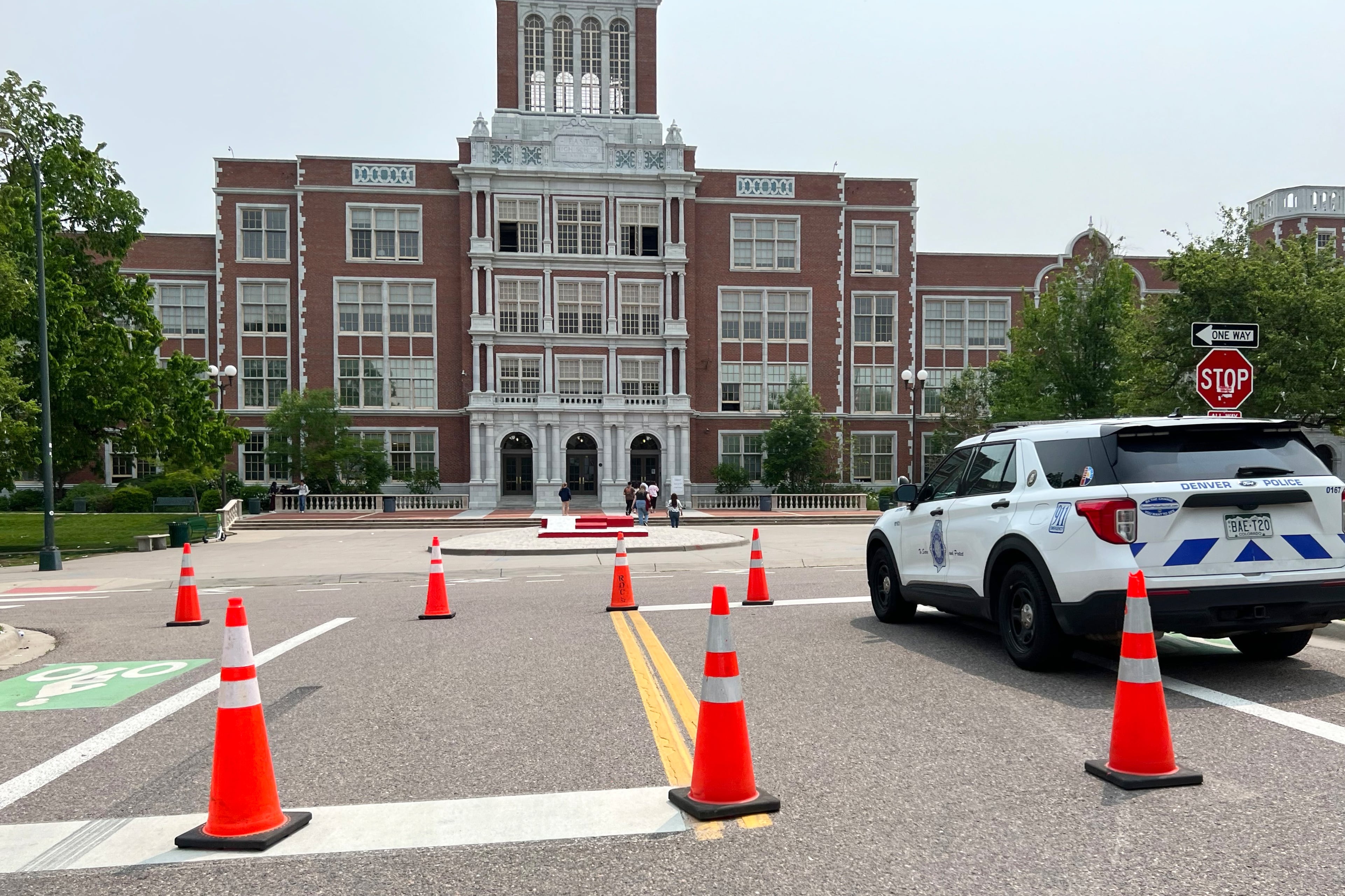 police car sits in front of a school