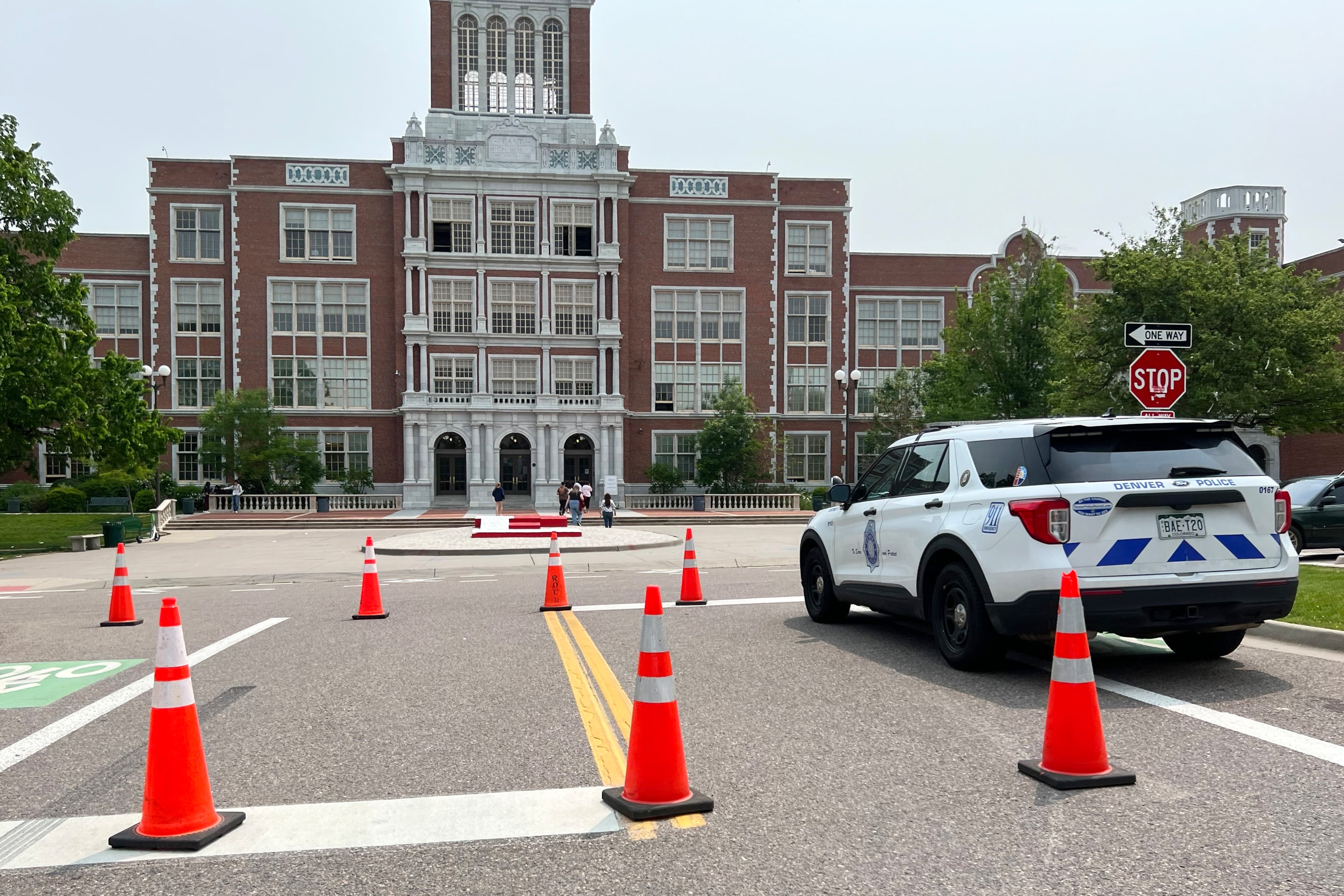 police car sits in front of a school
