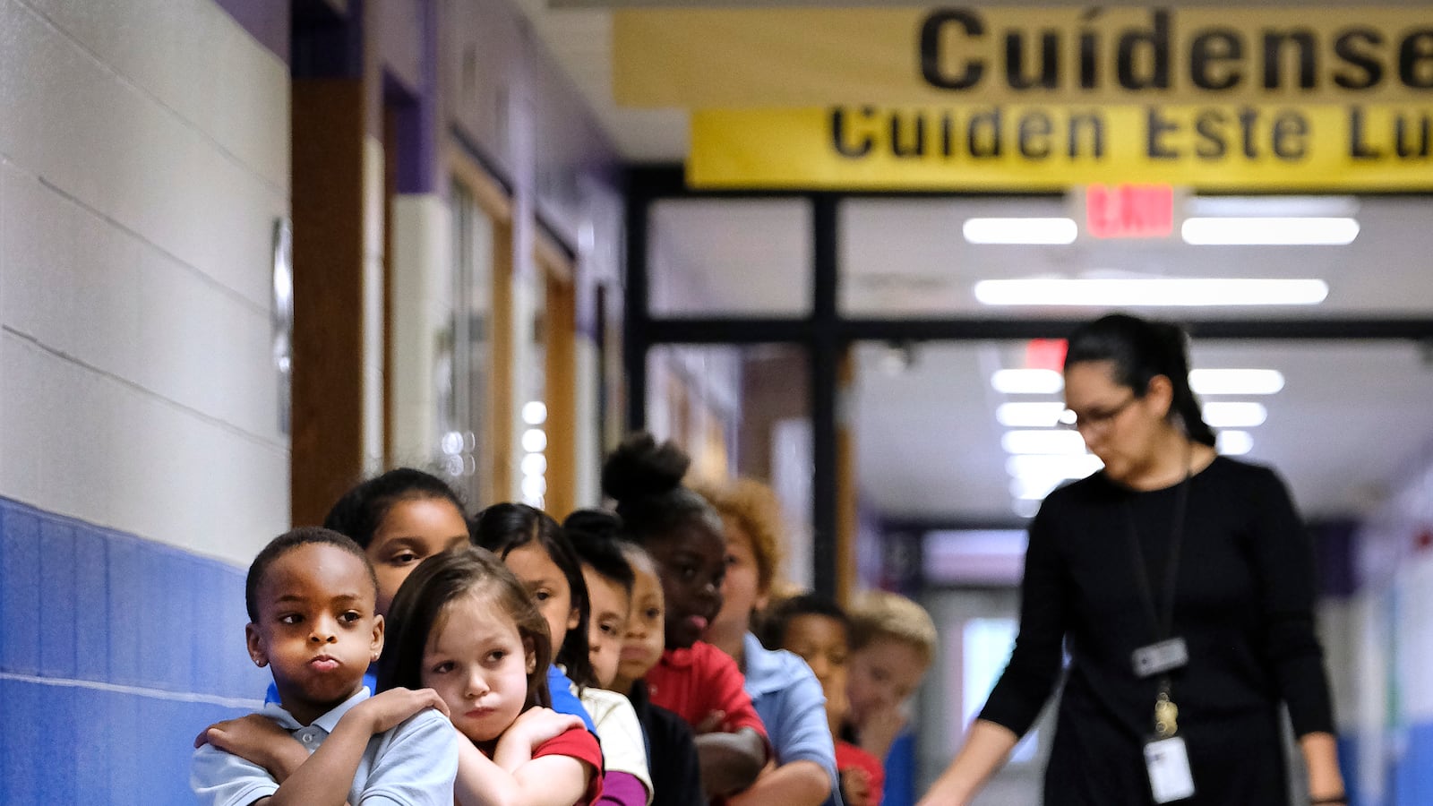 Students in a line in a hallway at Thomas Gregg Neighborhood School, an elementary school in Indianapolis, Indiana. —April, 2019— Photo by Alan Petersime/Chalkbeat