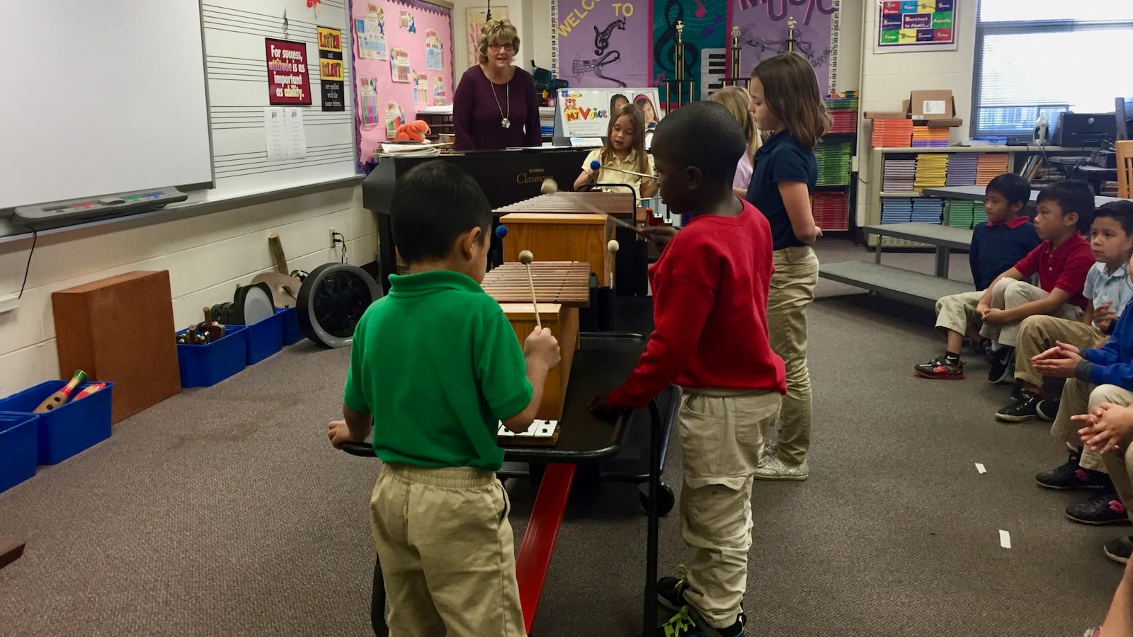 First-graders at William Henry Burkhart Elementary School tackle the xylophone to prepare for an open house performance.