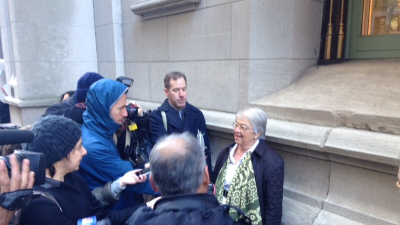 A larger press scrum than normal questions Chancellor Fariña after leaving a meeting with charter school leaders.