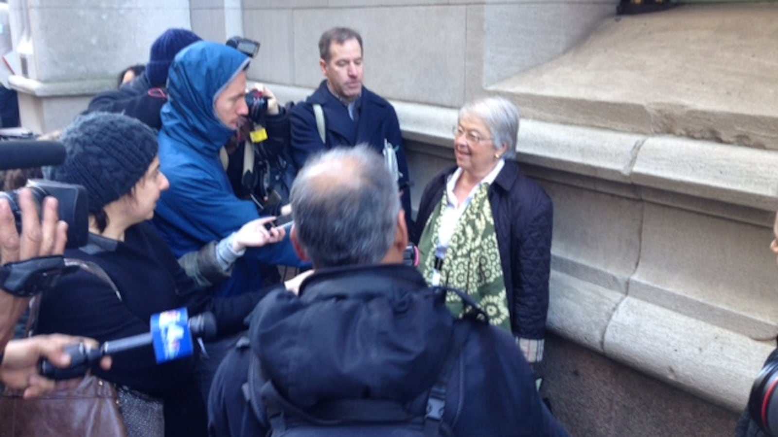 A larger press scrum than normal questions Chancellor Fariña after leaving a meeting with charter school leaders.