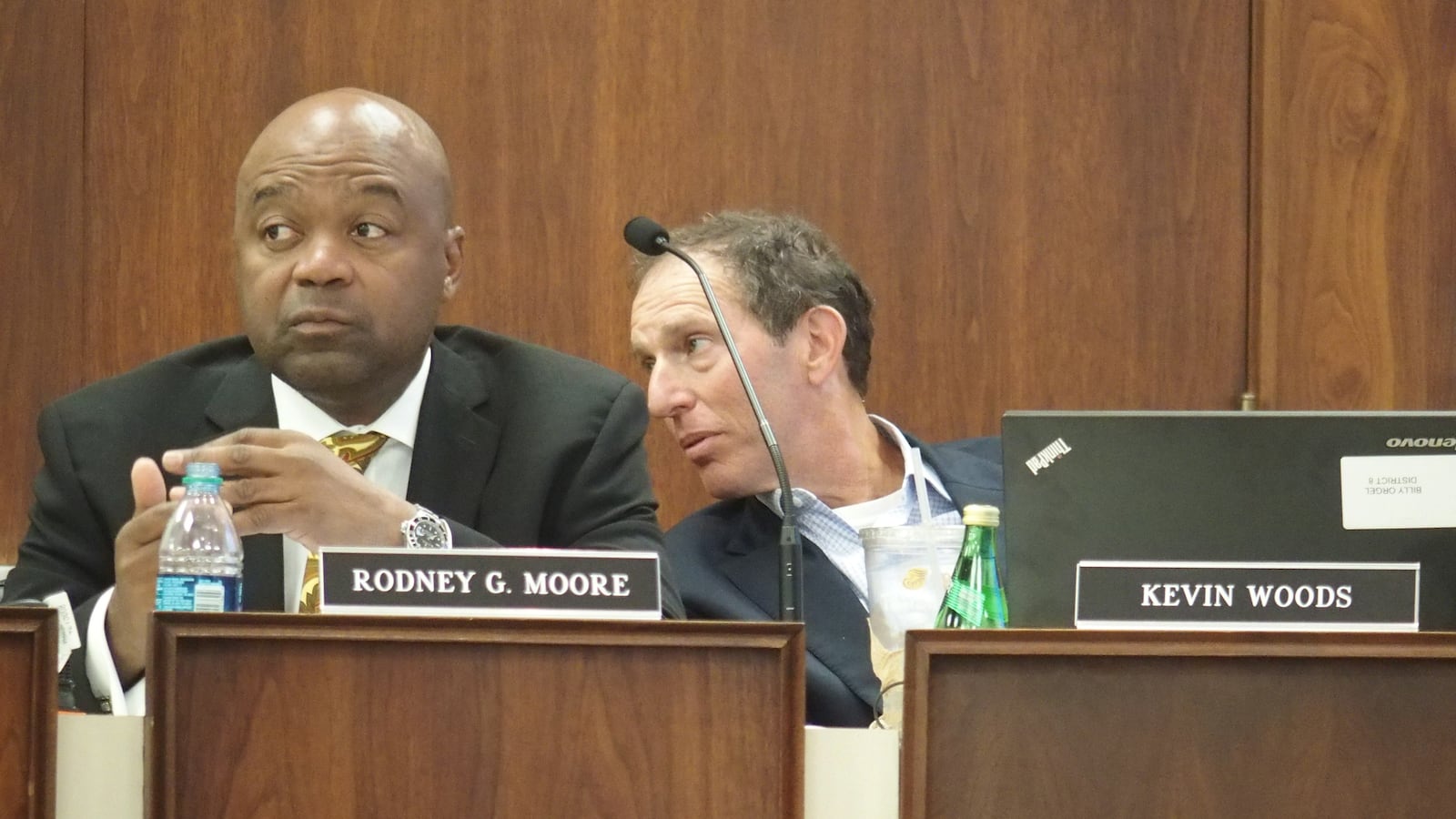 Rodney Moore and school board member Billy Orgel at an August meeting.