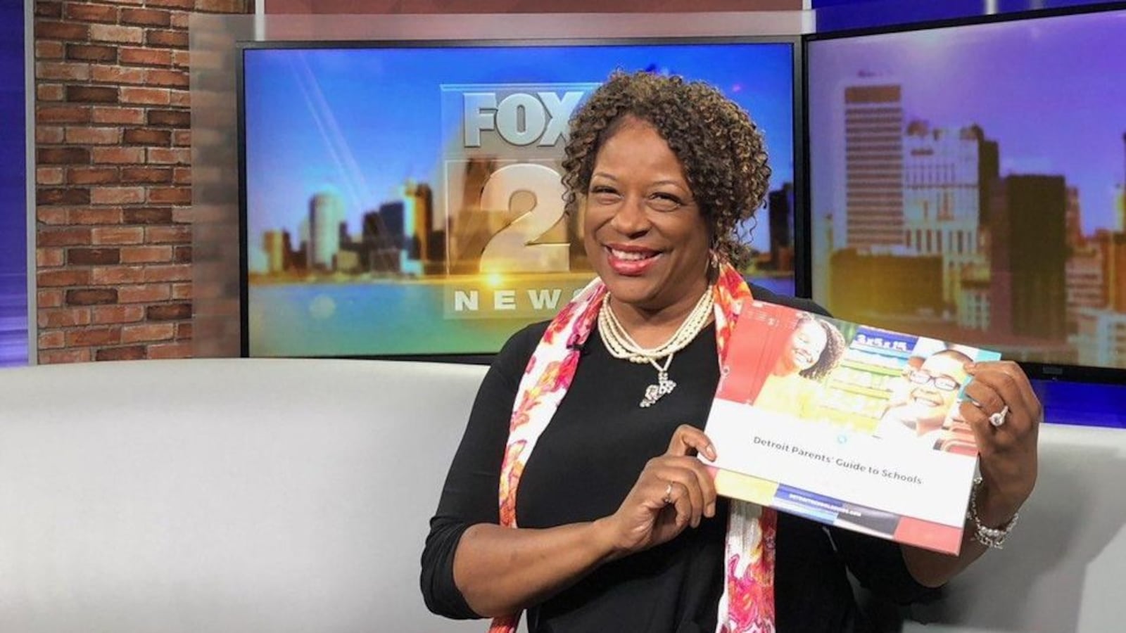 Monique Marks, chair of a new mayoral commission, showed off the group's Detroit schools guide in an appearance on local television. Future editions of the guide will include letter grades for every school.