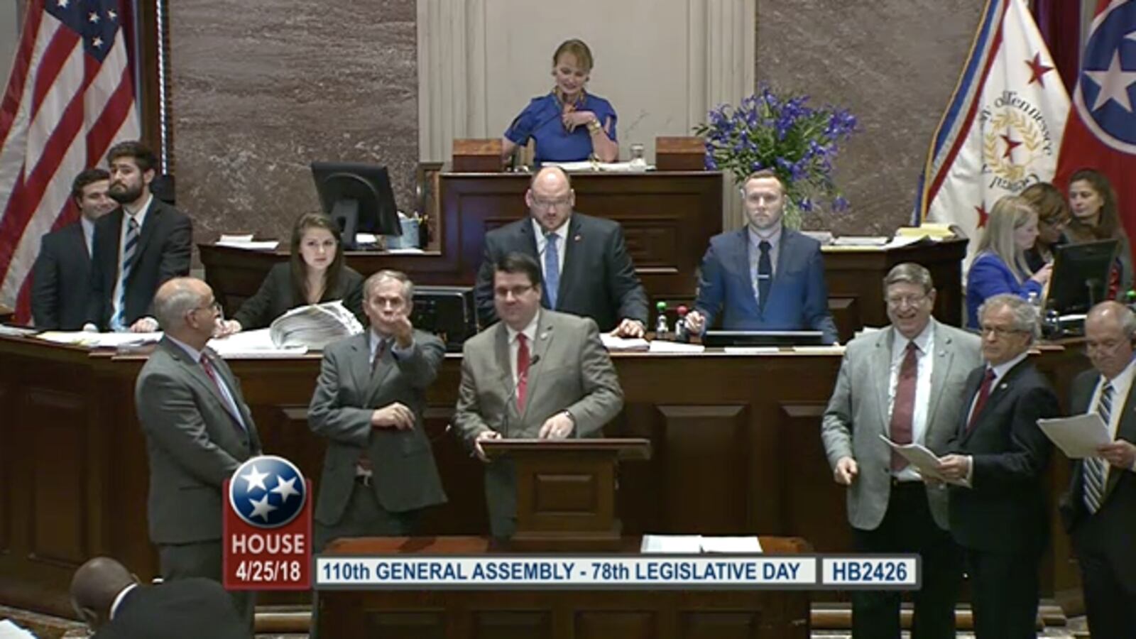 Rep. Eddie Smith of Knoxville stands at the front podium of the Tennessee House of Representatives on April 25, the last day of the 2018 legislative session, as the chamber's education leaders press for a bill to hold teachers harmless for this year's TNReady scores.
