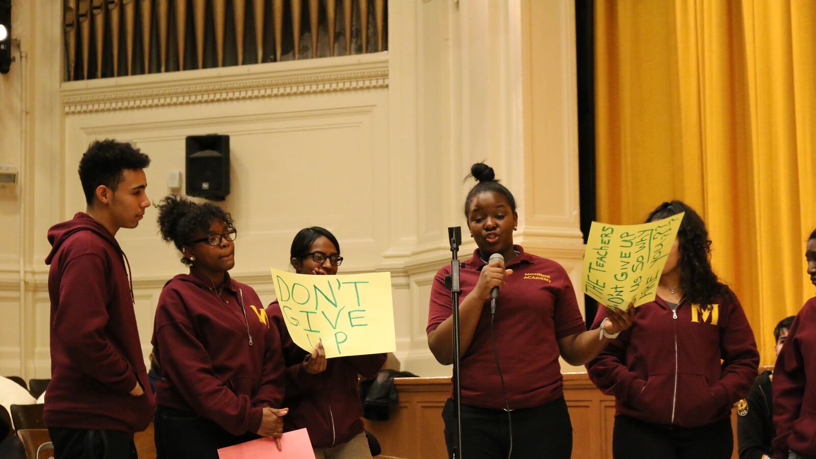 Students from Monroe Academy for Visual Arts and Design protest the planned closure of their school at a recent public hearing.