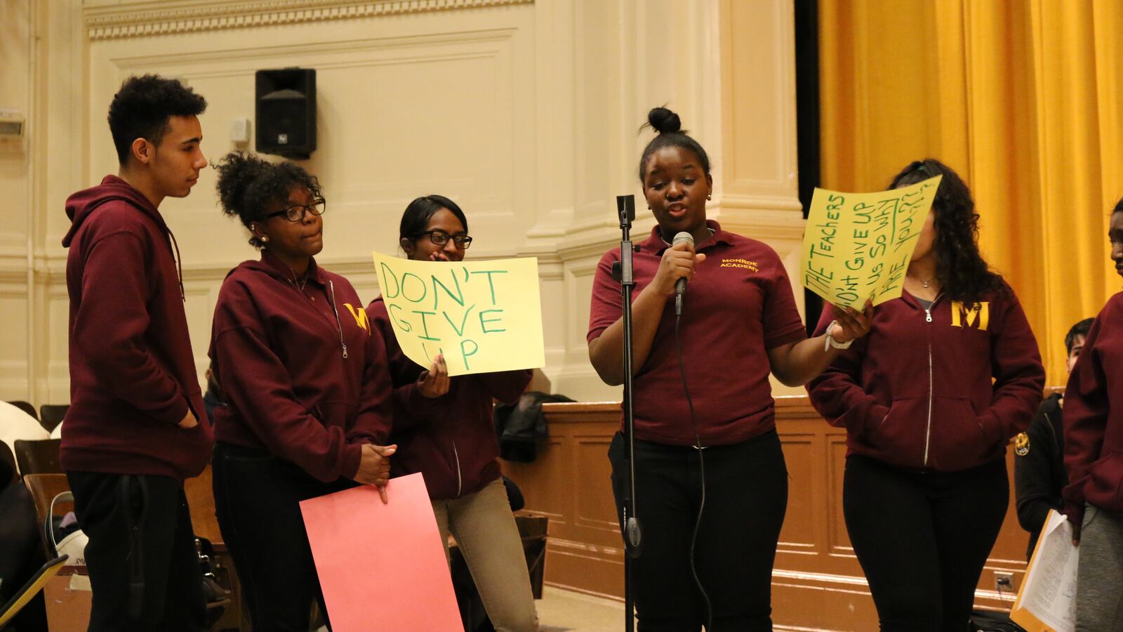 Students from Monroe Academy for Visual Arts and Design protest the planned closure of their school at a recent public hearing.