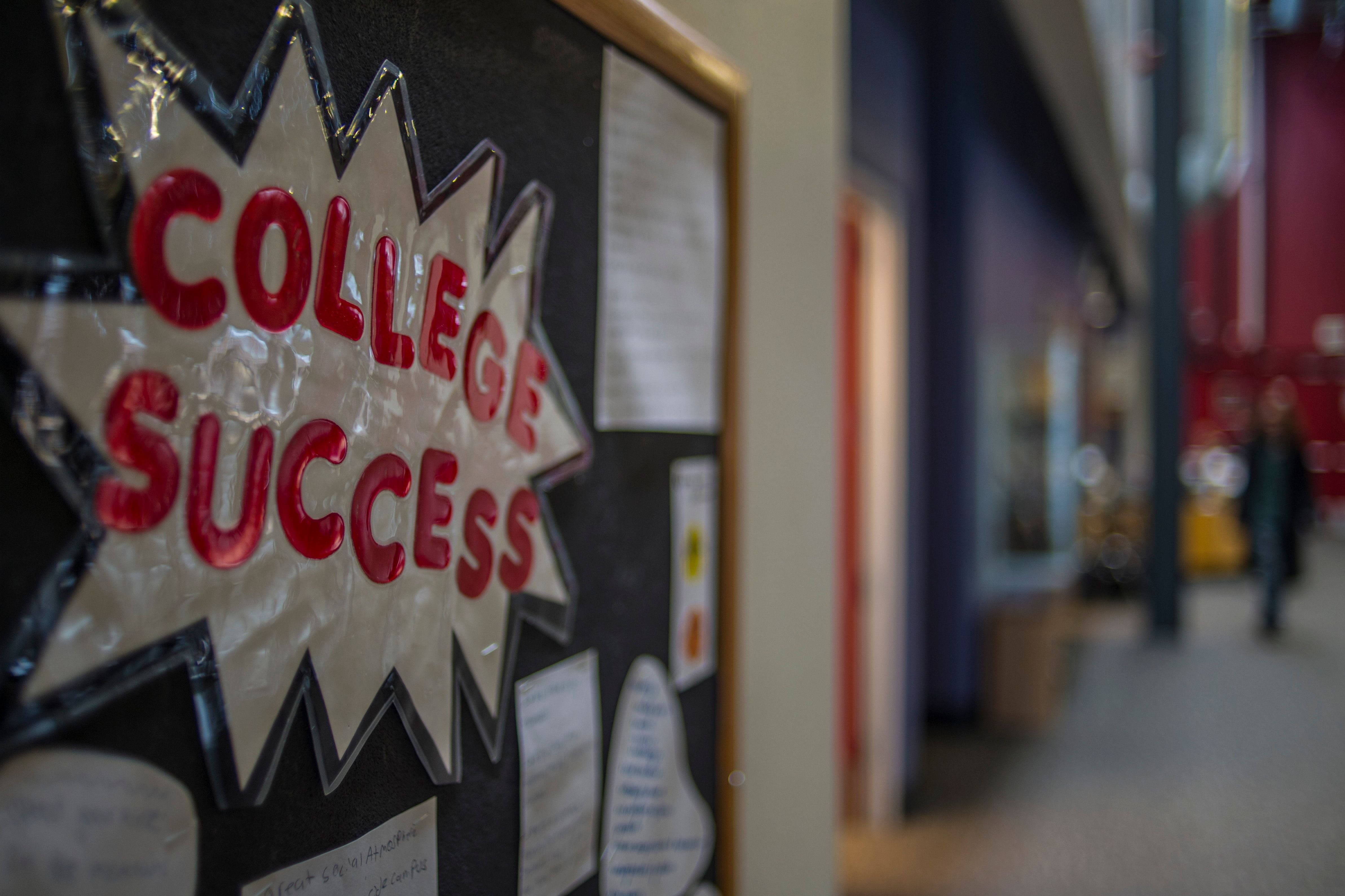 A bulletin board with a sign that reads “College Success” in bold red letters and a silver background.