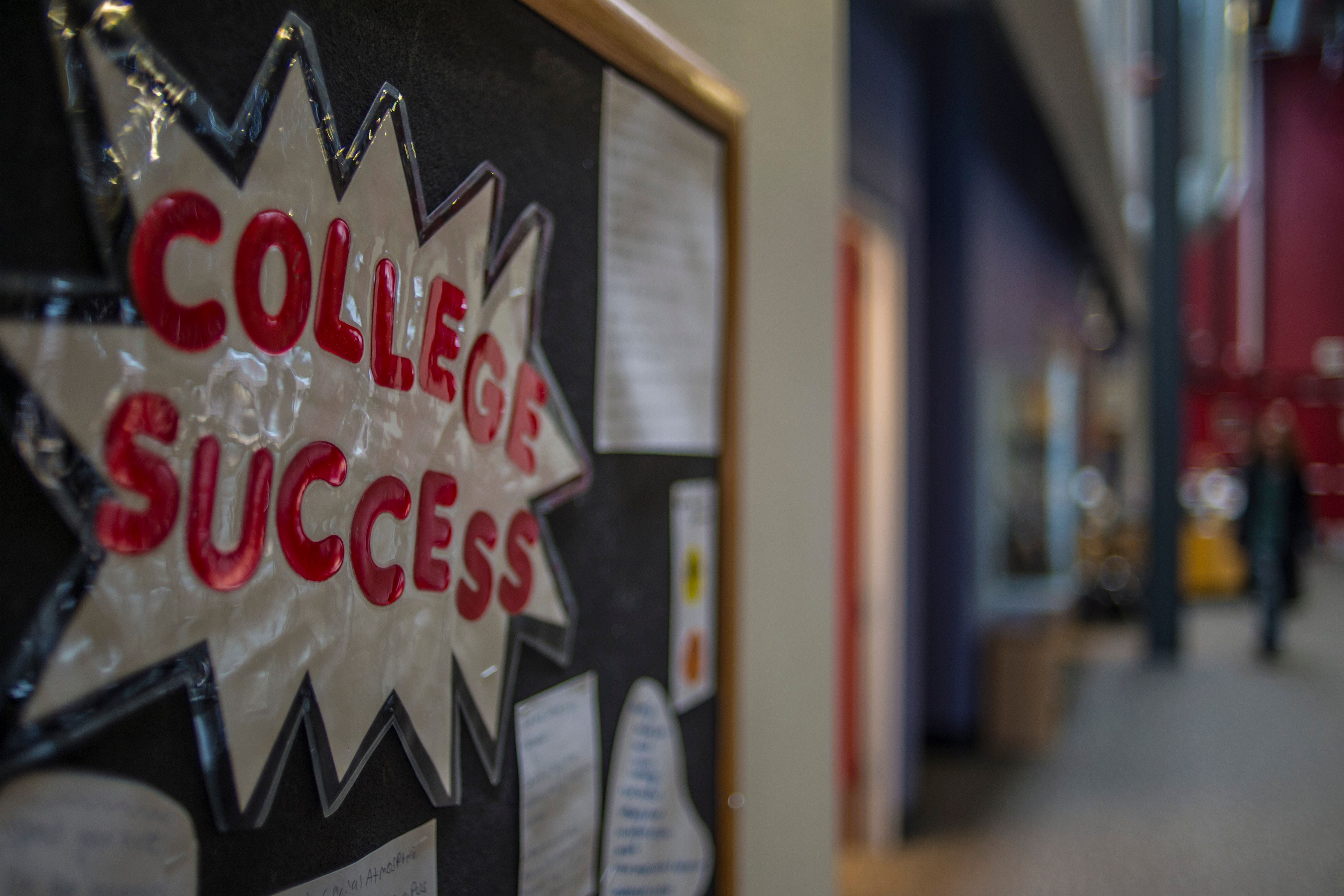 A bulletin board with a sign that reads “College Success” in bold red letters and a silver background.