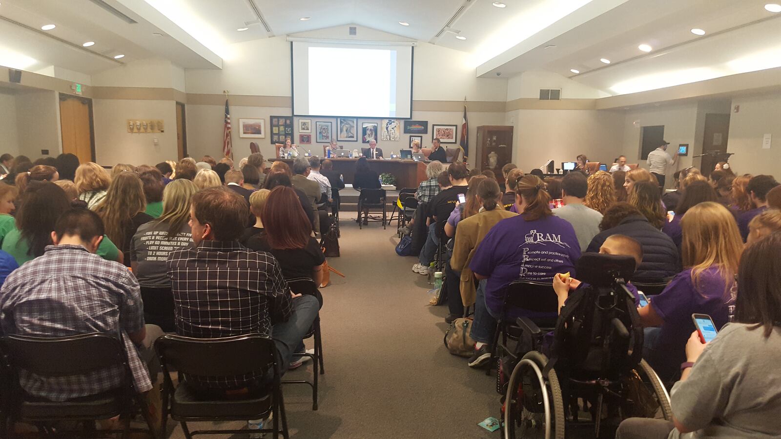 The Jeffco Public Schools board room is packed on Thursday for a discussion on school closures.