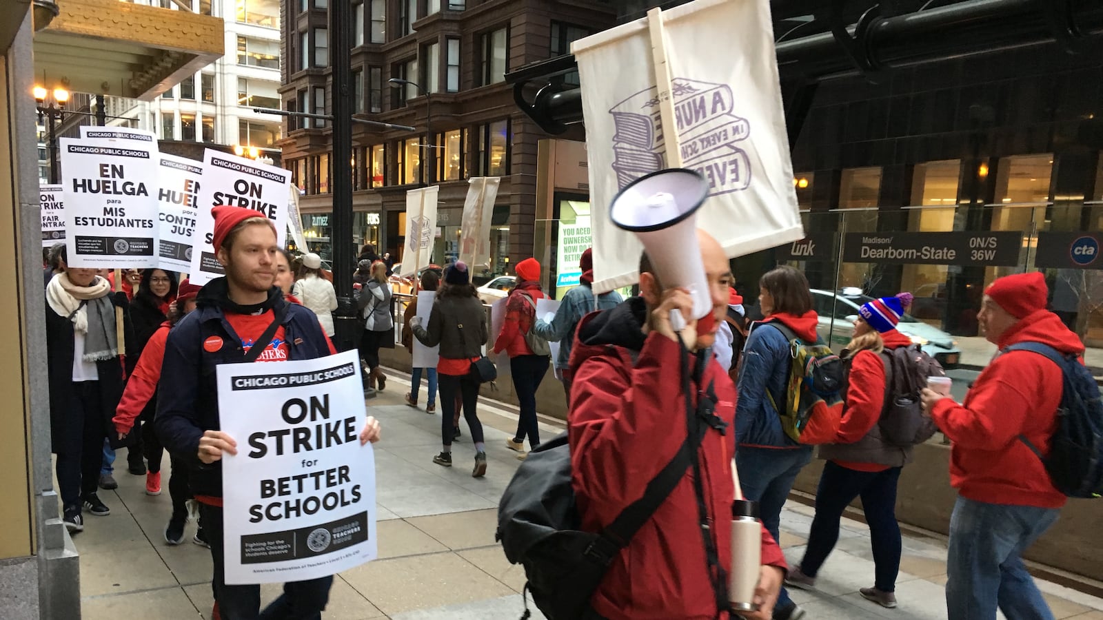 Chicago Teachers Union members picketed in downtown Chicago on the first day of the union’s strike.