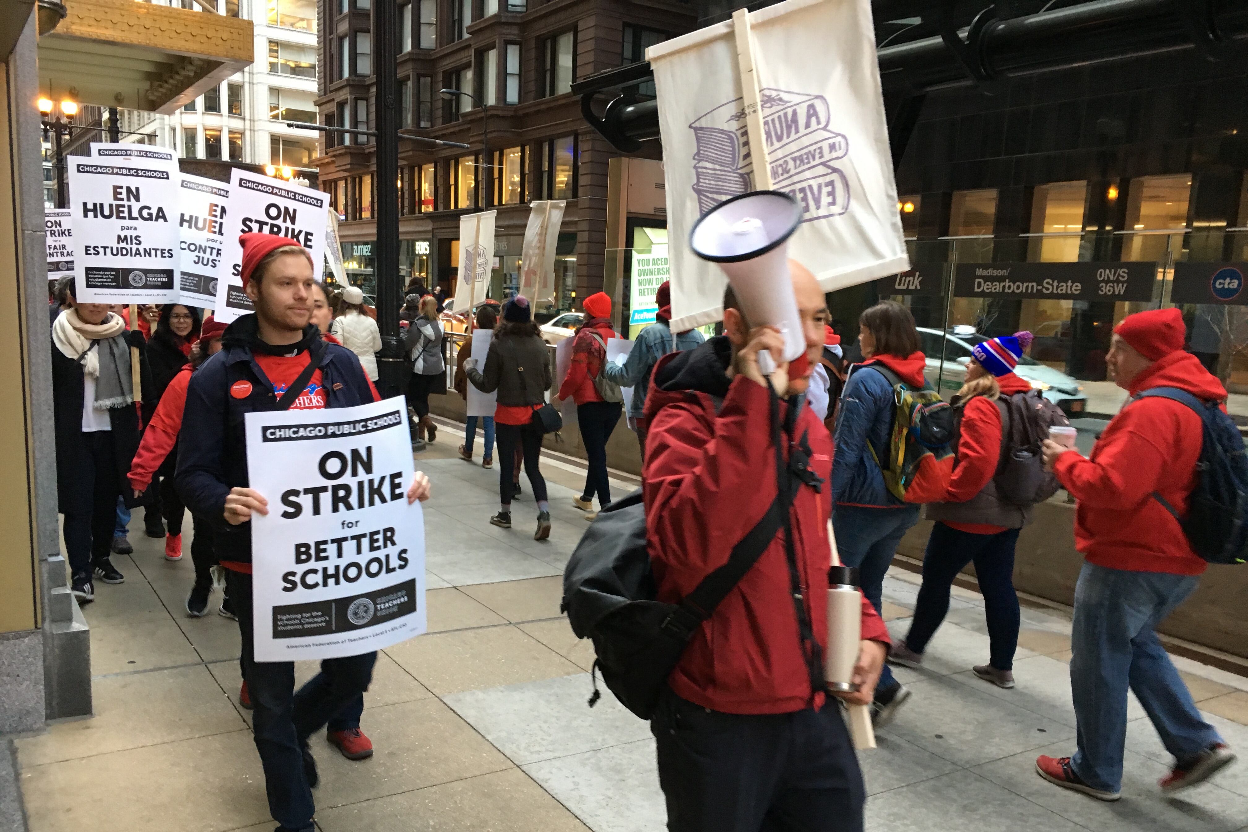 Chicago Teachers Union members picketed in downtown Chicago on the first day of the union’s strike.