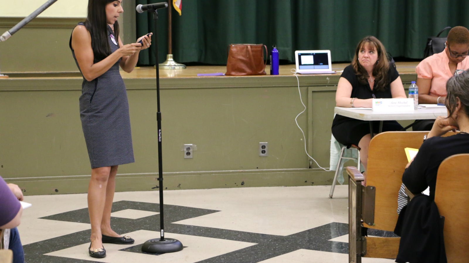 A P.S. 452 parent spoke out Monday evening against the city's plan to move and rezone the school.