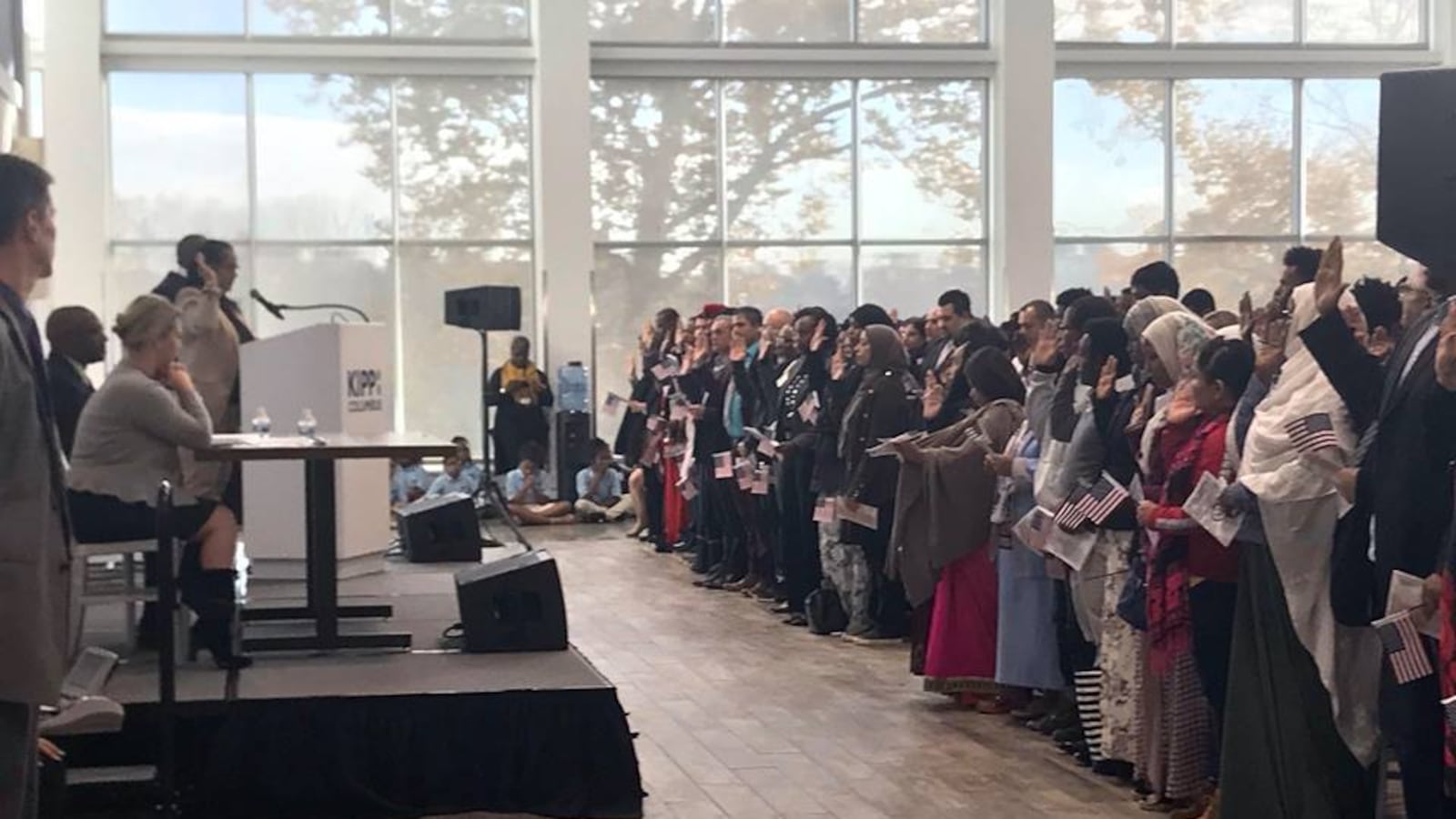 Milica Bison, a KIPP Columbus Spanish teacher, led the Pledge of Allegiance at an on-campus naturalization ceremony.